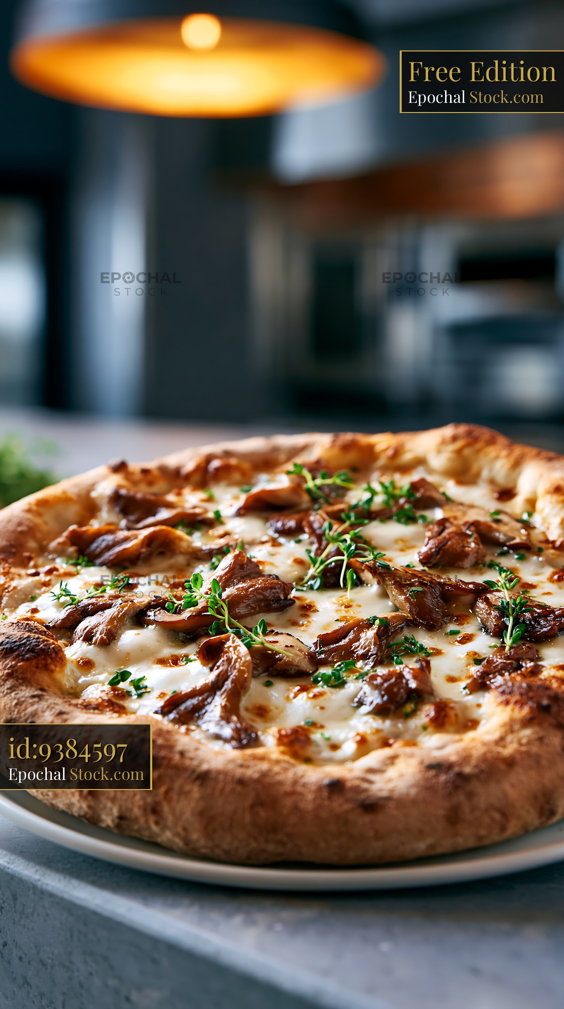 Freshly baked porcini mushroom pizza with herbs in a rustic kitchen - stock photo