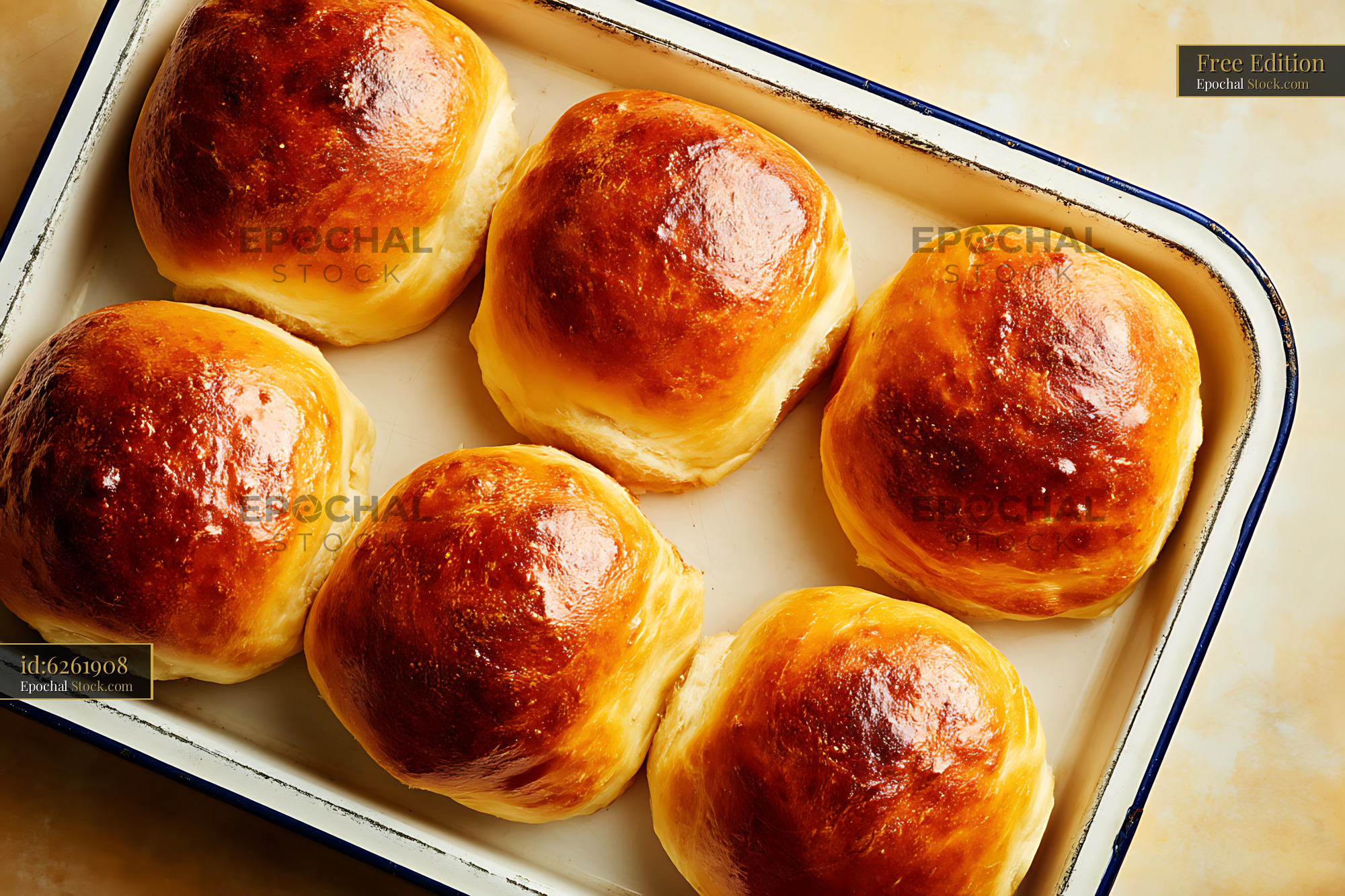 Golden Bierocks Fresh from Oven on Parchment Paper Baking Tray - stock photo