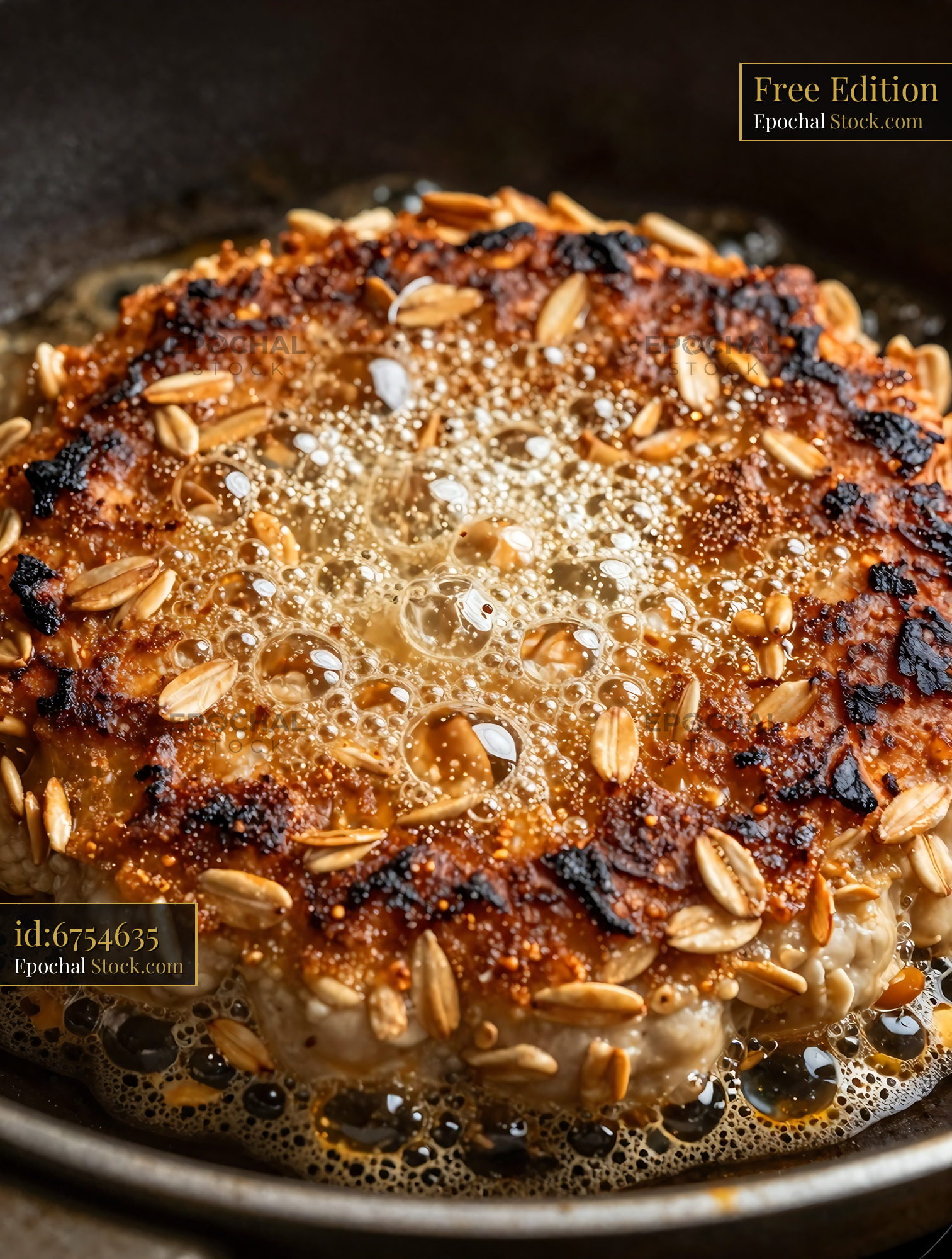 Goetta Sizzling in Pan with Sesame Seeds - stock photo