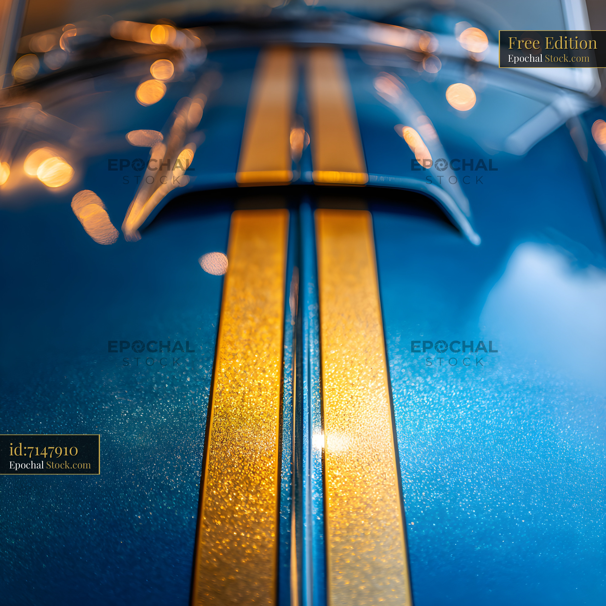 Vintage blue car hood with gold stripes and reflections Free Premium Stock Image