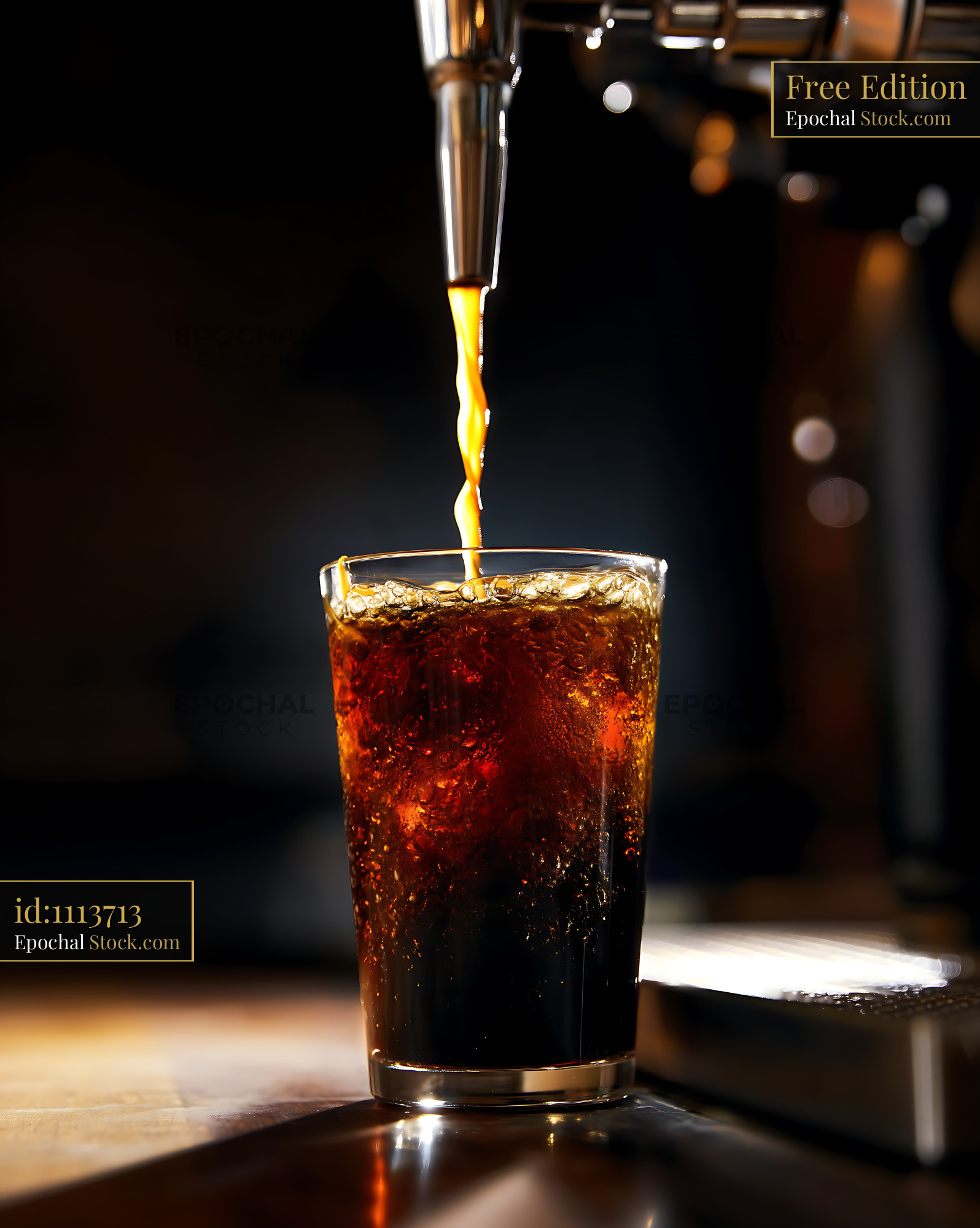 Nitro Caramel Coffee Cascading Into Glass - stock photo