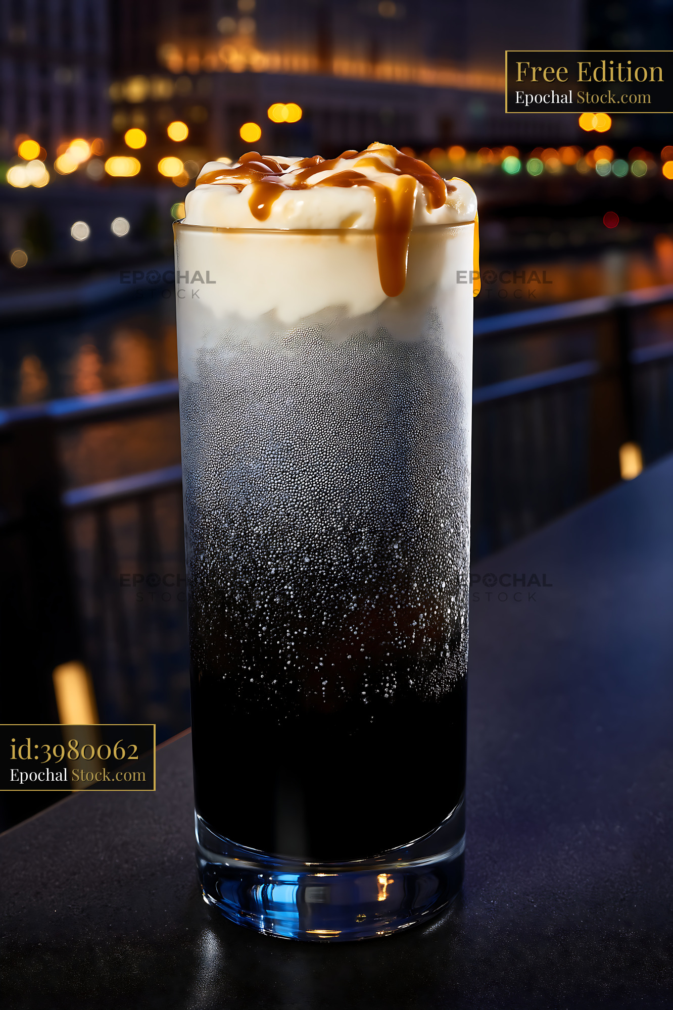 Nitro Caramel Coffee Against Nighttime Cityscape - stock photo