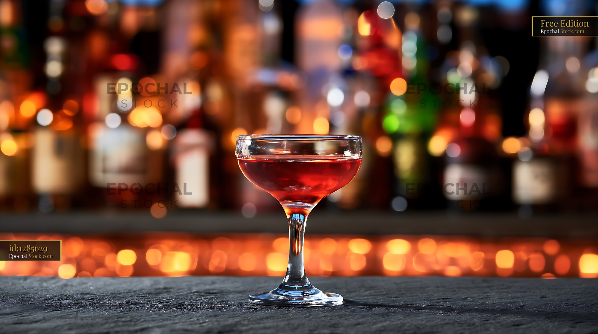 Bushwick Cocktail in Coupe Glass with Bar Bokeh - stock photo