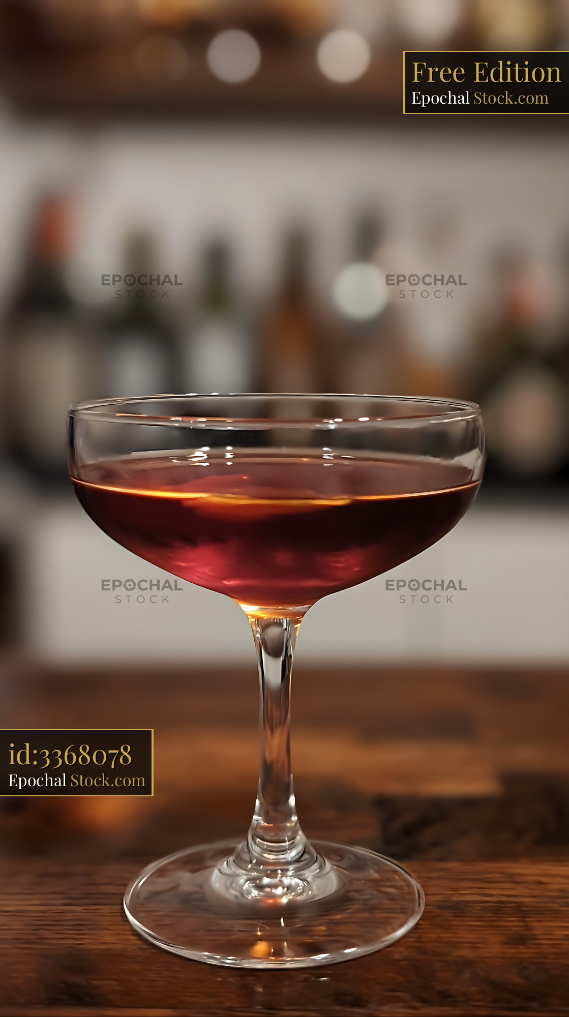 Bushwick Cocktail in Coupe Glass on Bar - stock photo