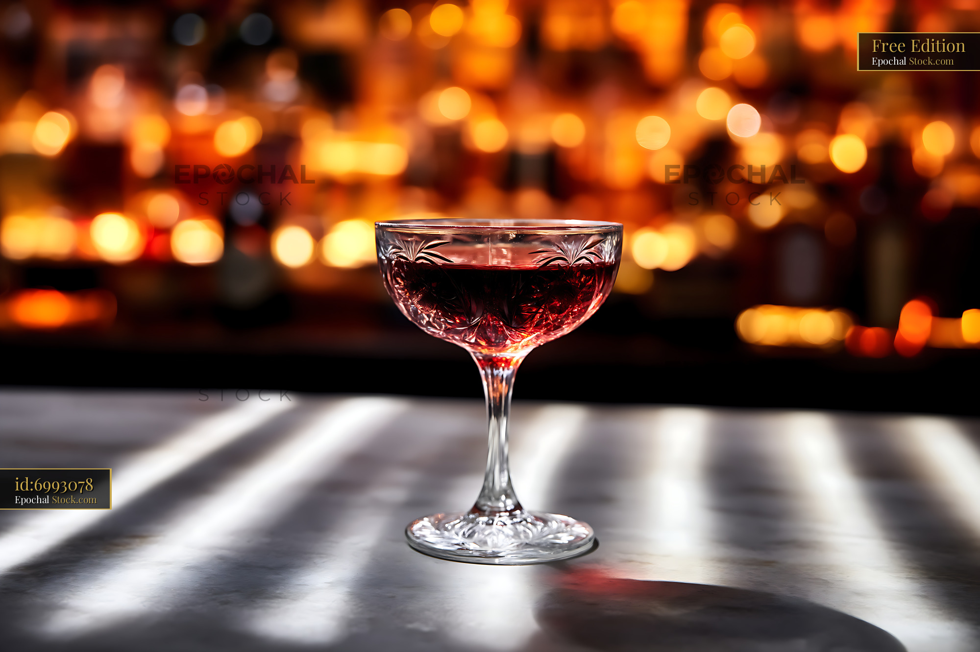 Bushwick Cocktail in Coupe Glass at Bar - stock photo