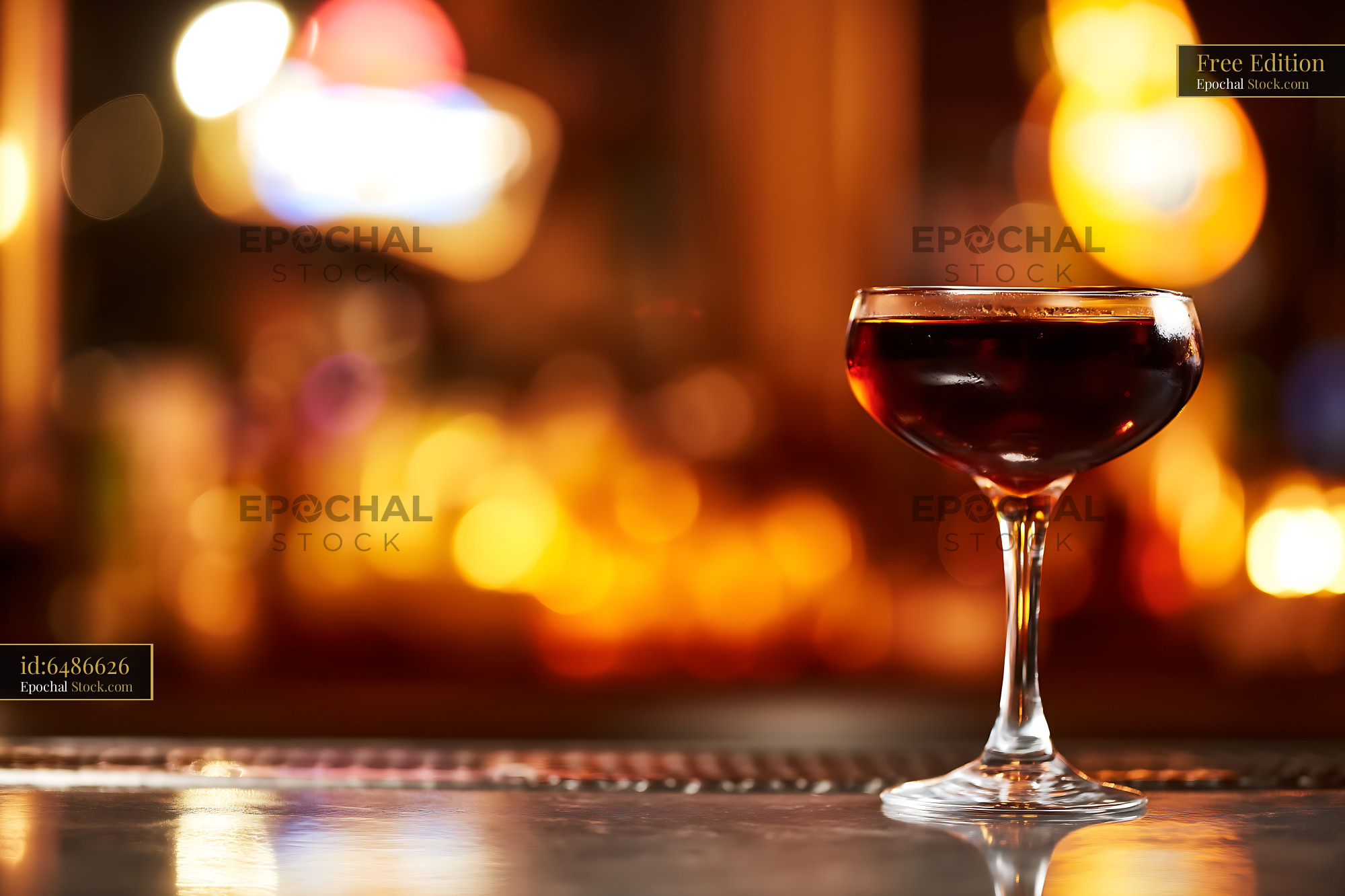 Bushwick Cocktail in Coupe Glass at Bar - stock photo