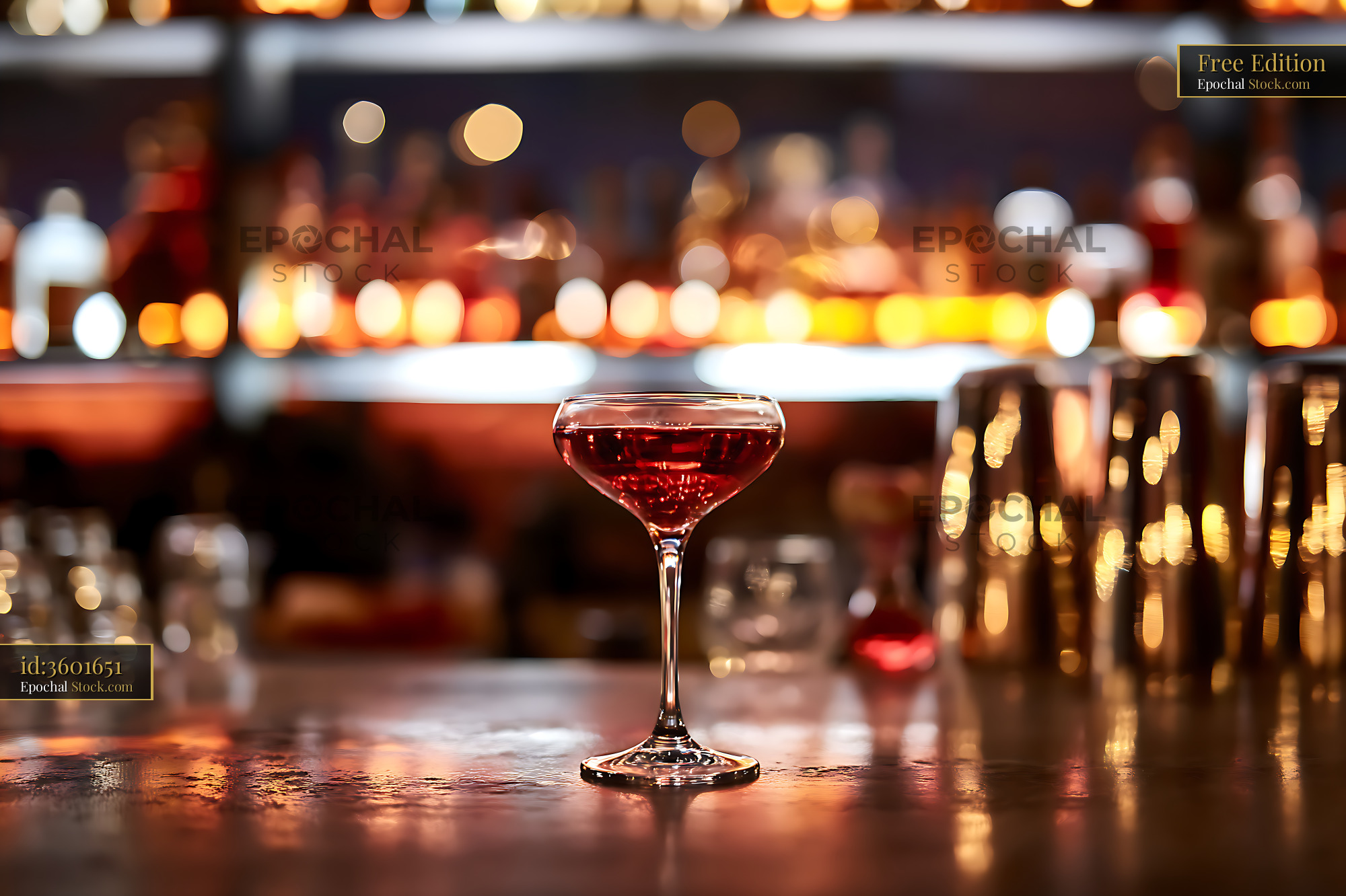 Elegant Red Cocktail at Upscale Bar Counter - stock photo