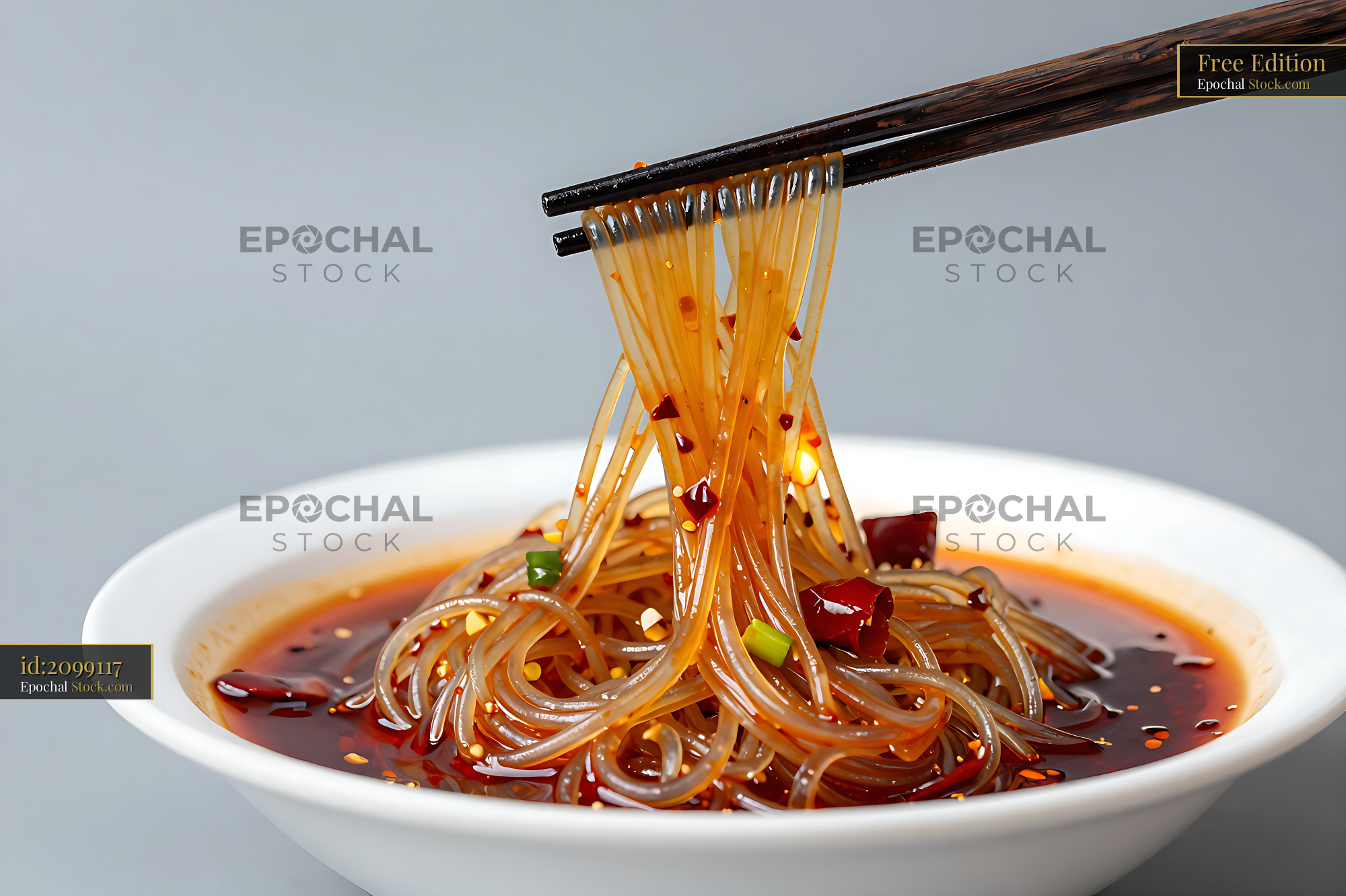 Sichuan Glass Noodle Salad Lifted with Chopsticks - stock photo