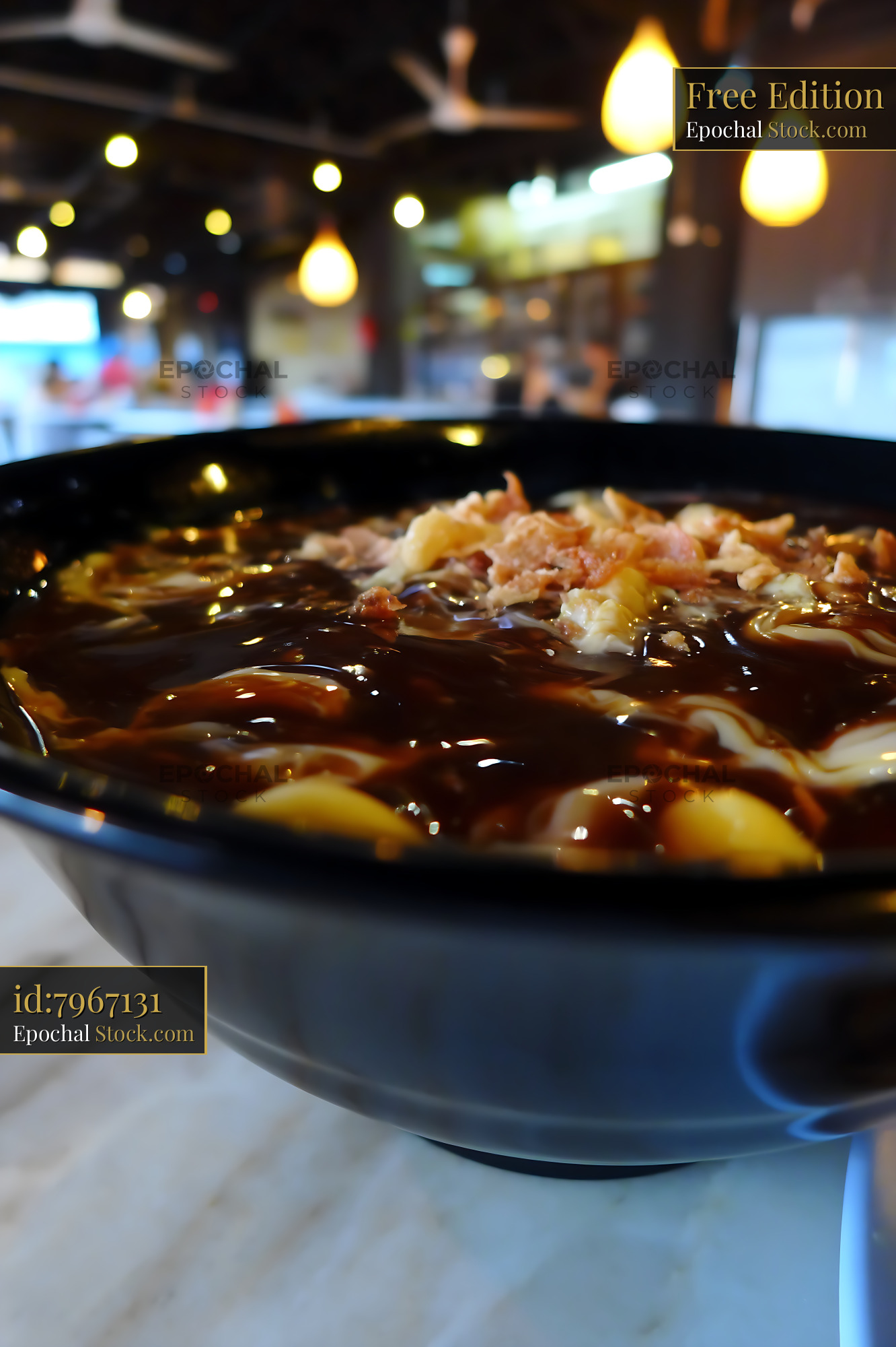 Close-up of Traditional Lor Mee Soup with Crispy Toppings - stock photo