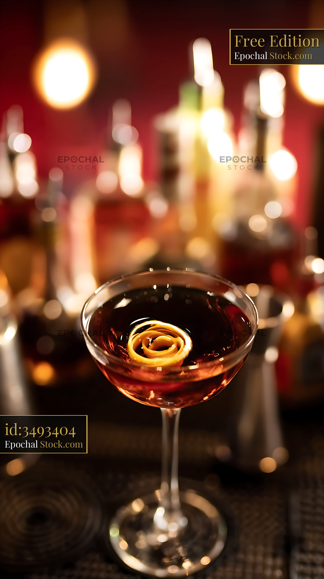 Sophisticated Cocktail with Orange Peel Garnish at Bar - stock photo