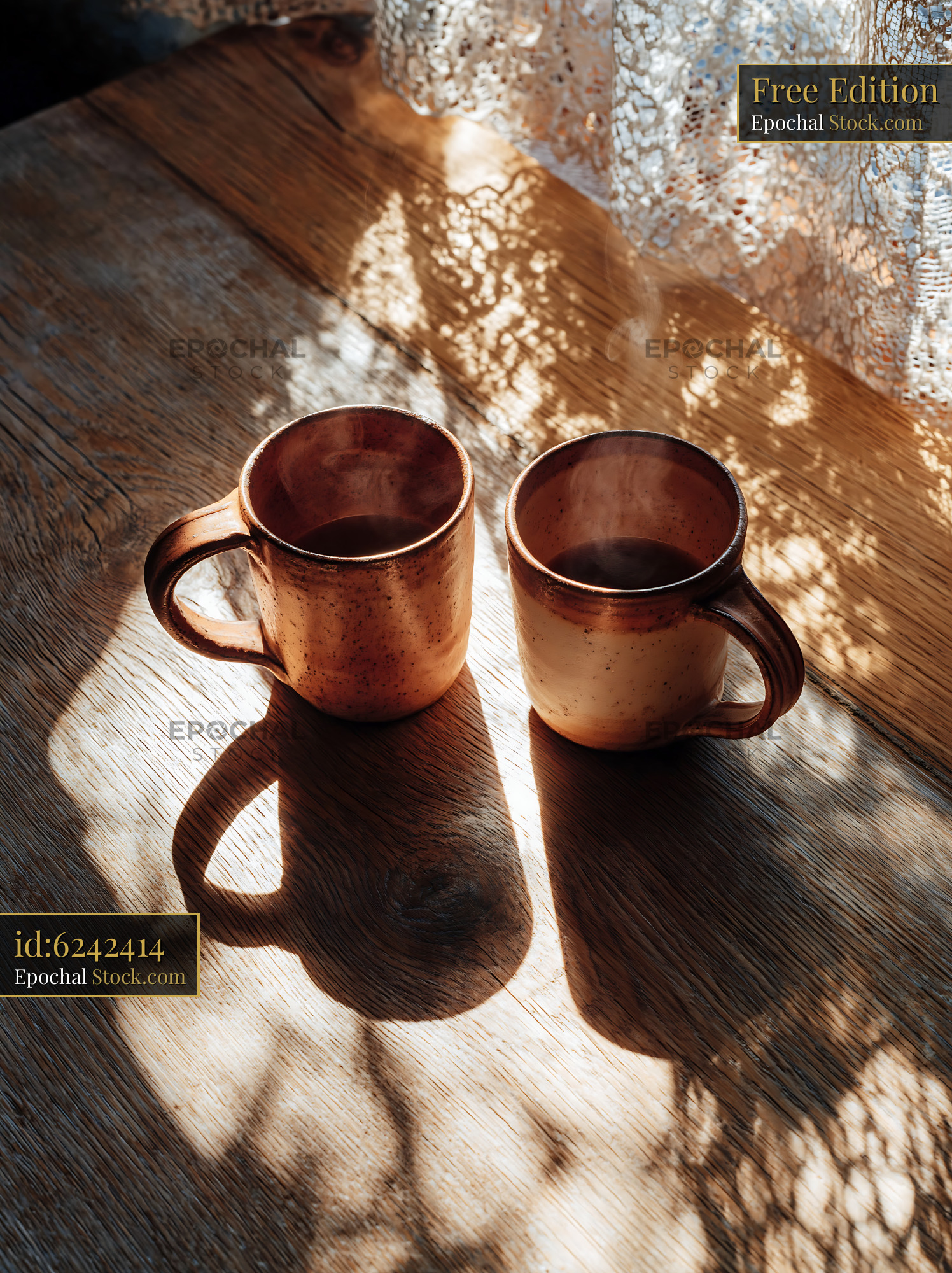 Two ceramic mugs of steaming coffee on a rustic wooden table - stock photo