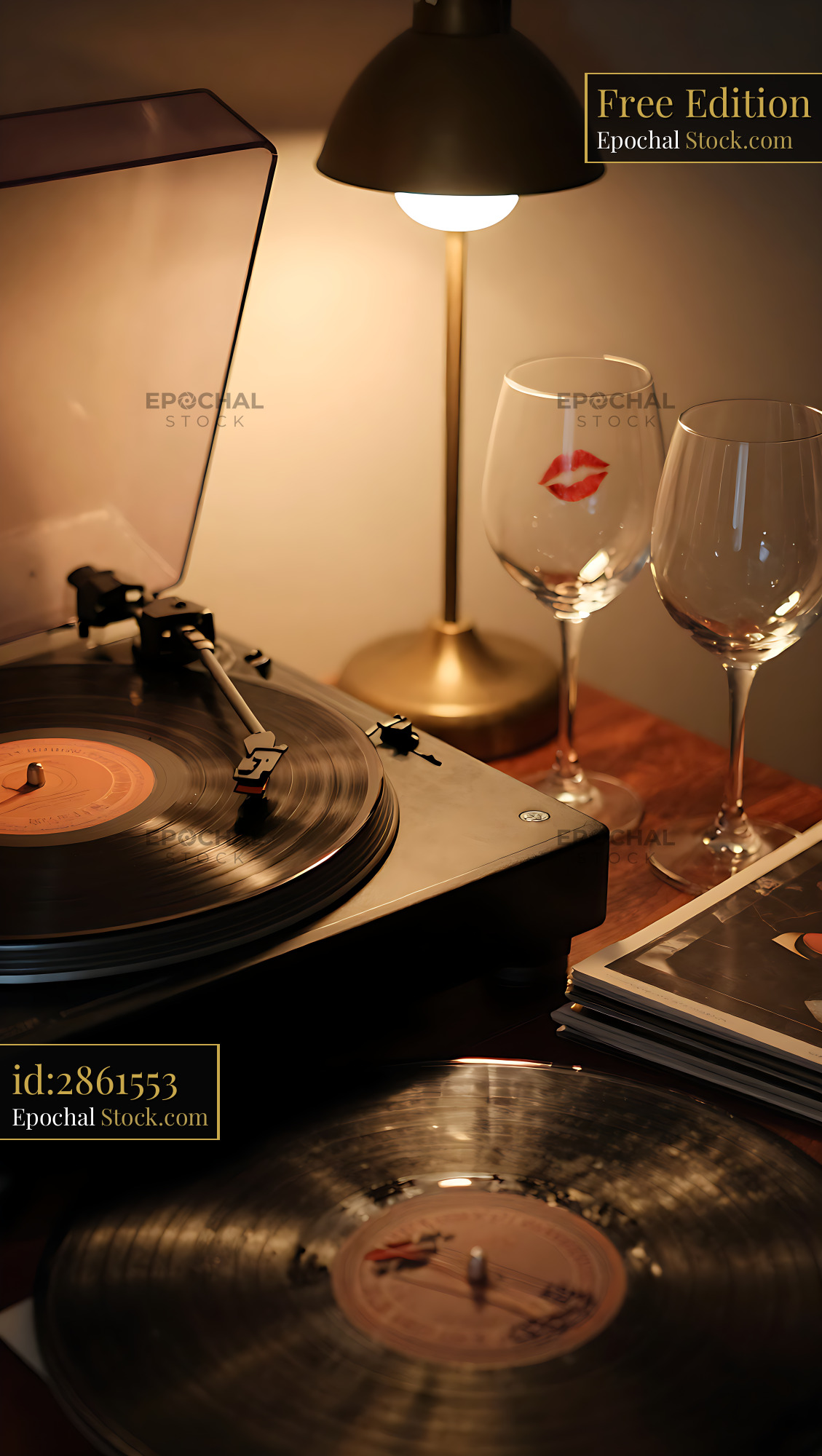 Vintage record player and wine glasses with lipstick mark at night