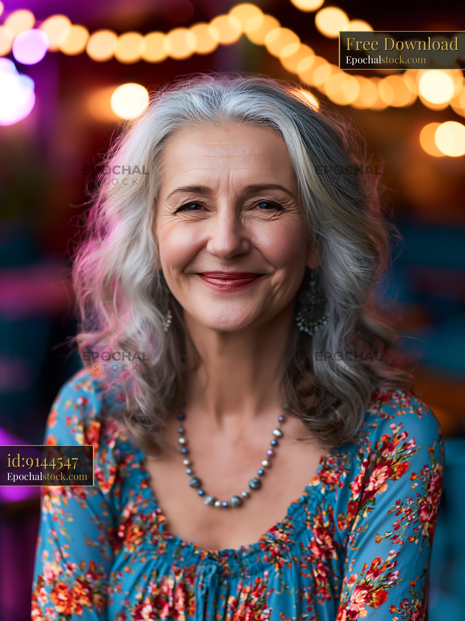 Watermarked full-resolution preview of Smiling woman with gray hair sitting in colorful setting