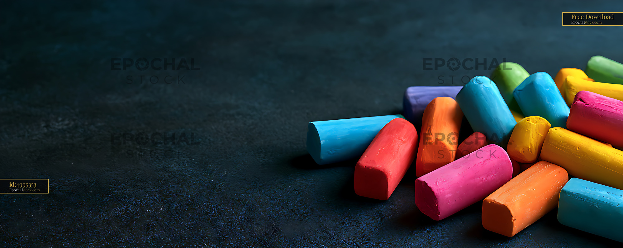 Watermarked full-resolution preview of Colorful chalk pieces scattered on a dark surface