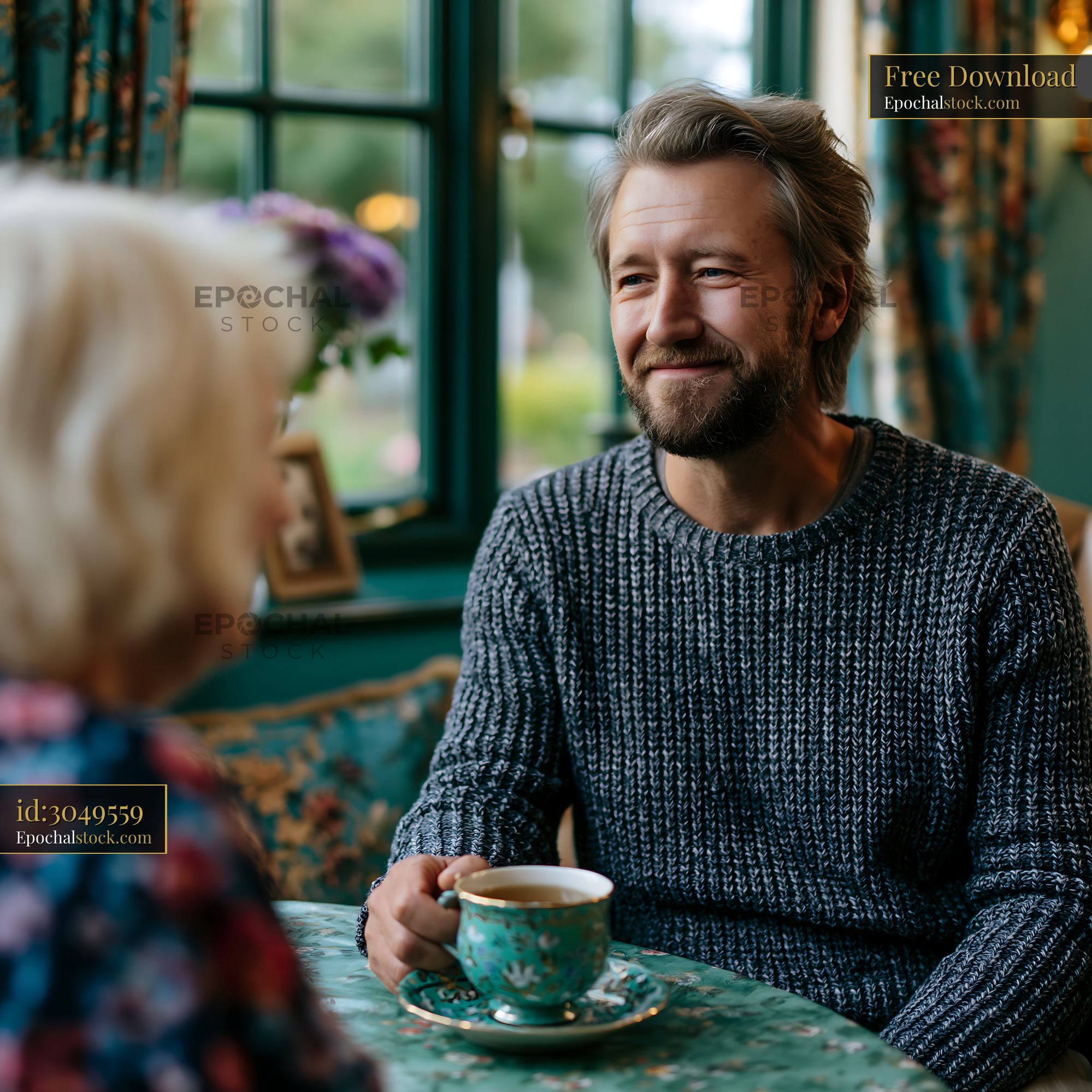 Watermarked full-resolution preview of Man and woman talk over tea in cozy cafe