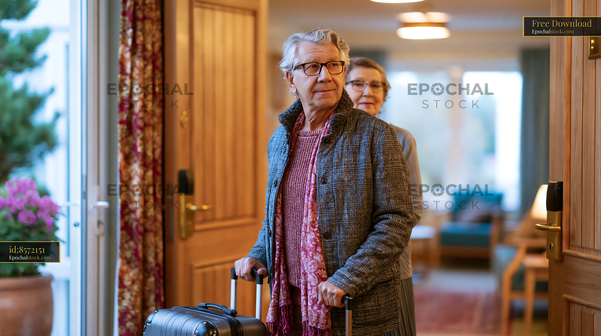 Watermarked full-resolution preview of Elderly couple entering a home with luggage during daytime