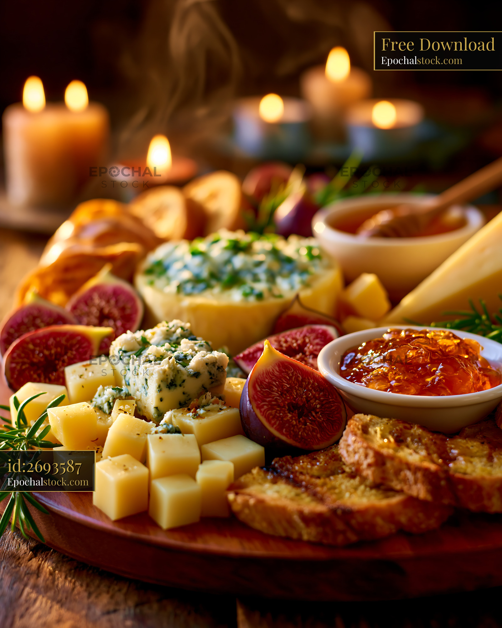Watermarked full-resolution preview of Cheese and fruit platter with candles on a wooden table
