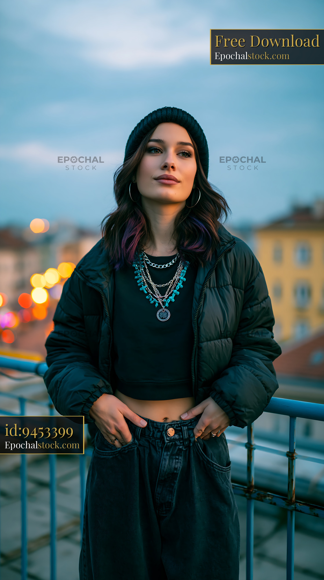 Watermarked full-resolution preview of Young woman posing on rooftop during twilight