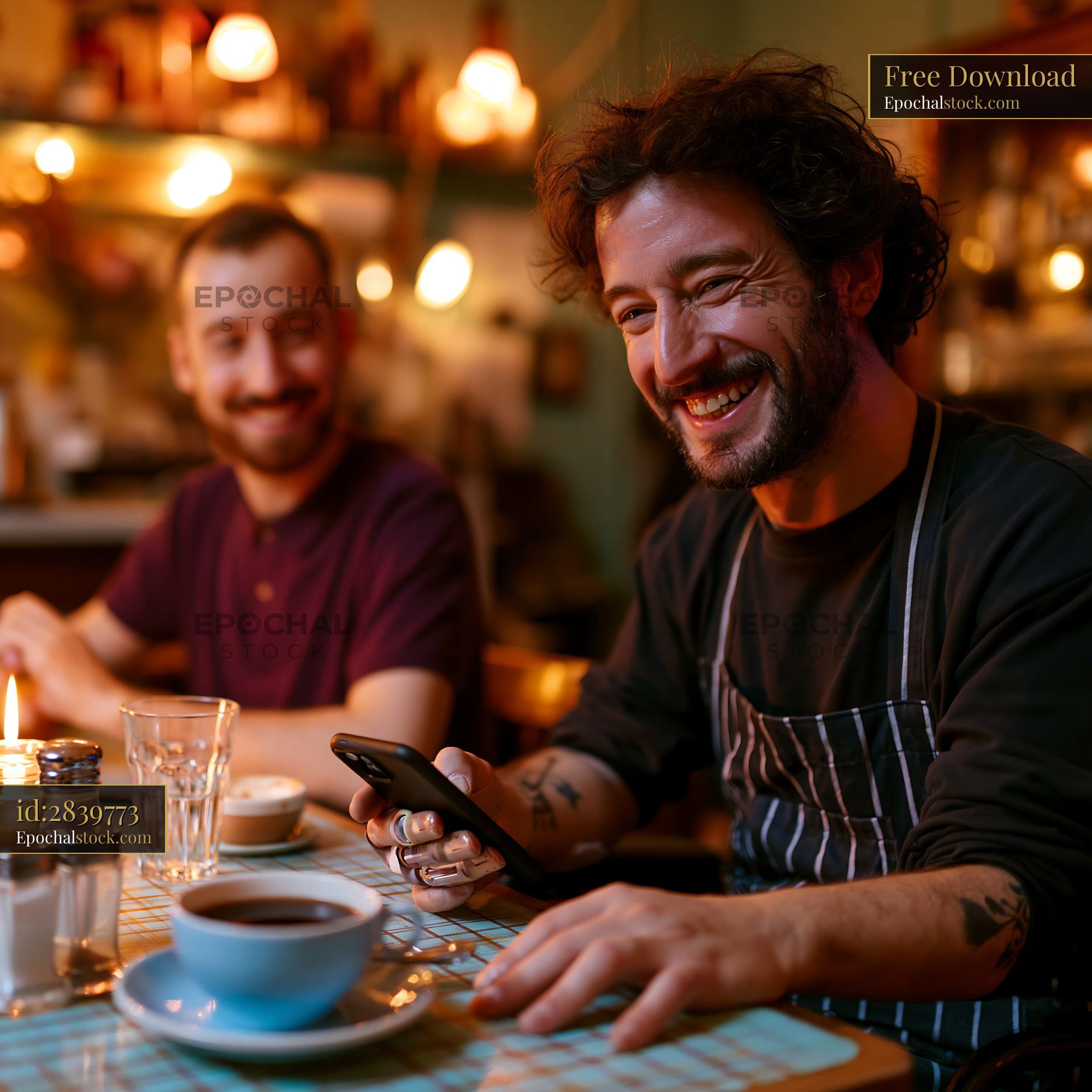 Watermarked full-resolution preview of Café worker smiling while using a smartphone