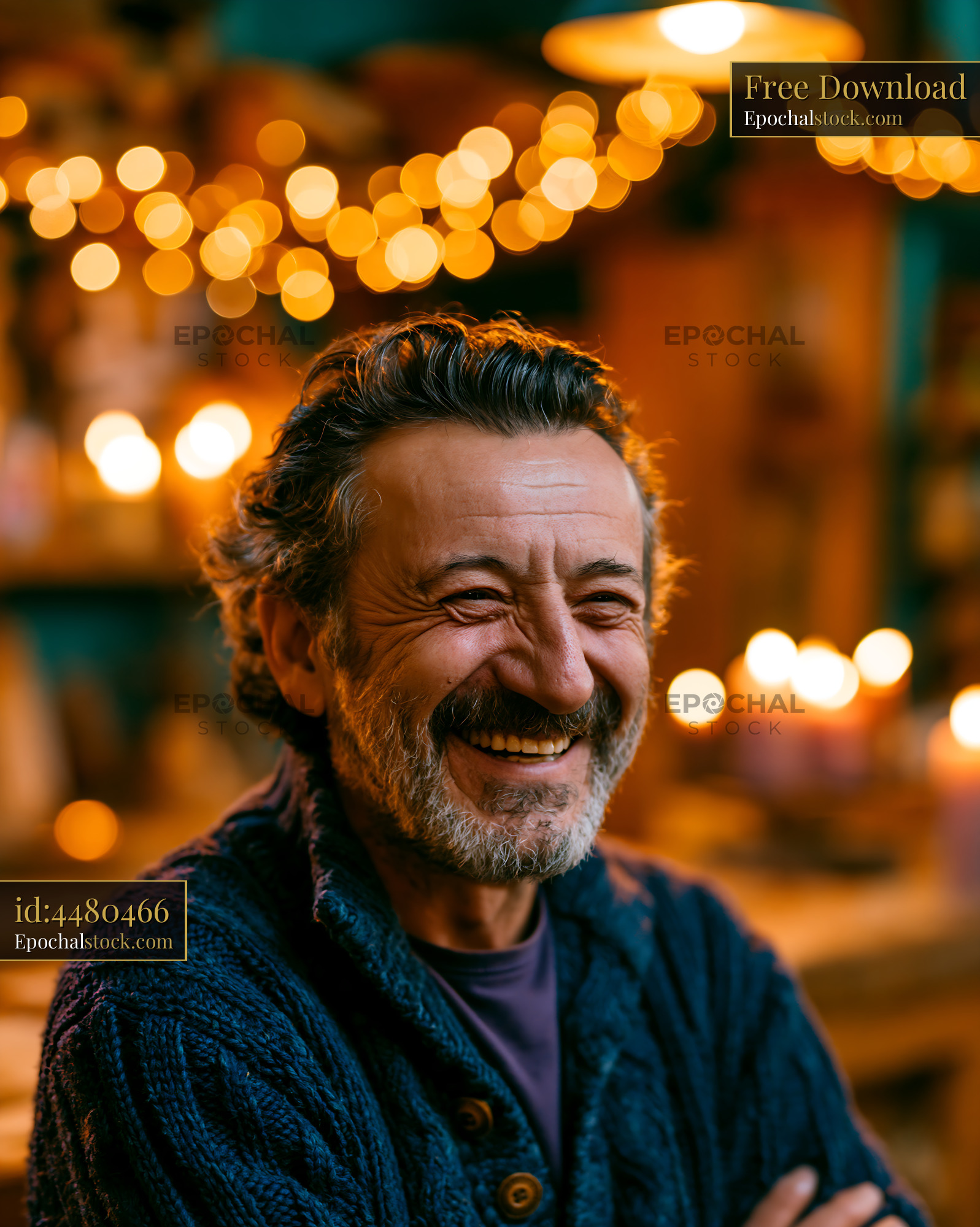 Watermarked full-resolution preview of Man smiling in cozy setting with warm lights
