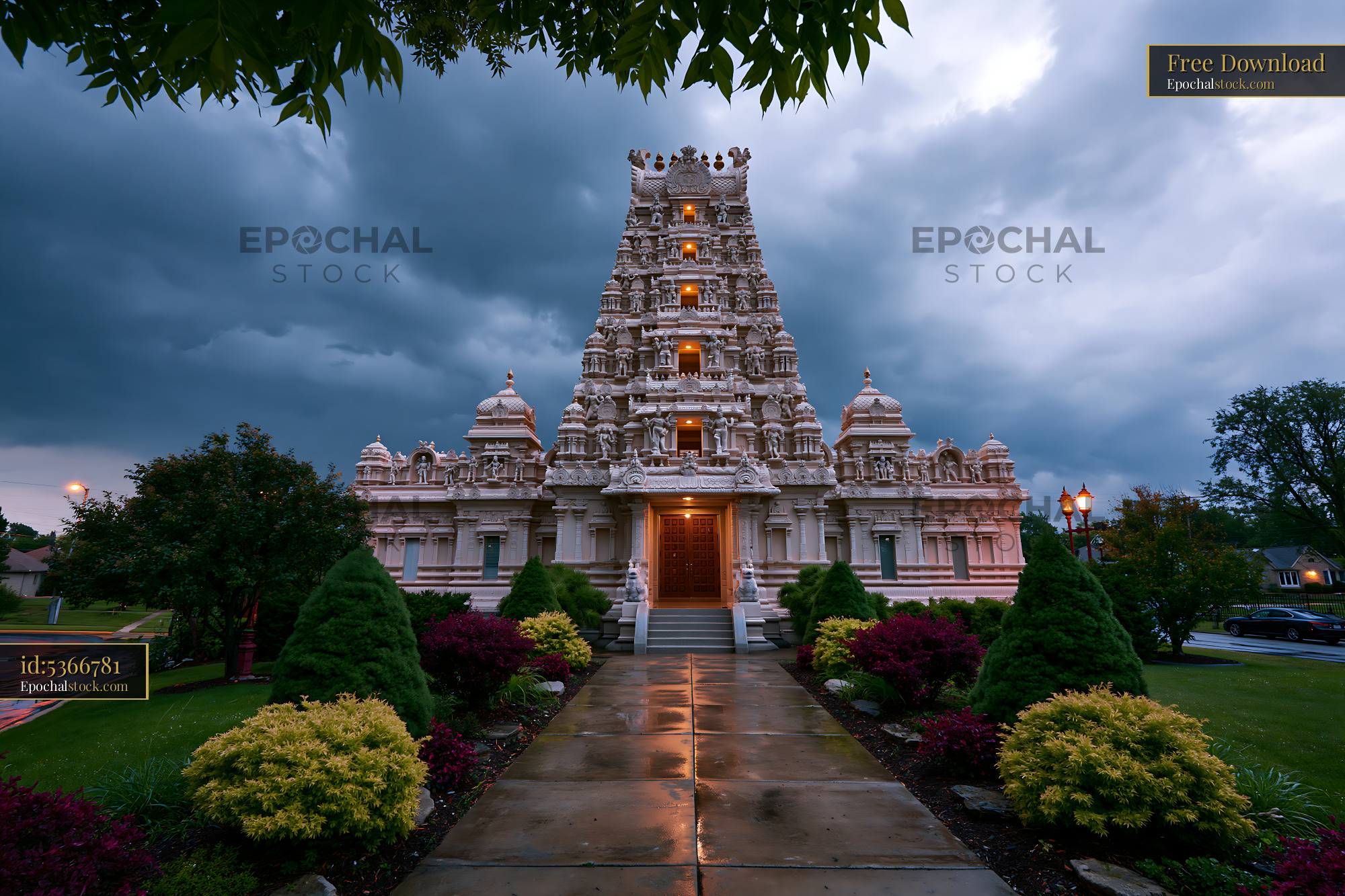 Watermarked full-resolution preview of Hindu temple in a garden setting under cloudy sky