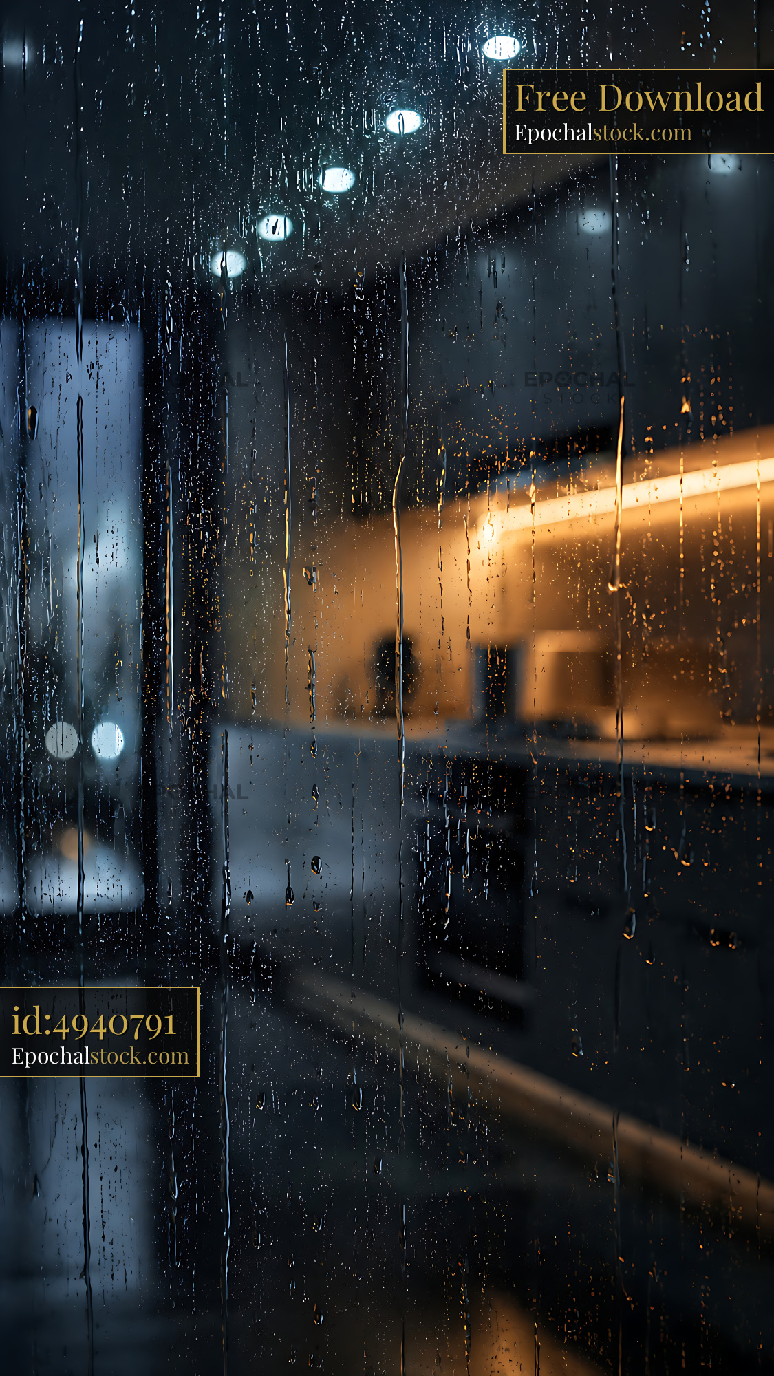 Watermarked full-resolution preview of Kitchen interior view through rain-covered glass window at night