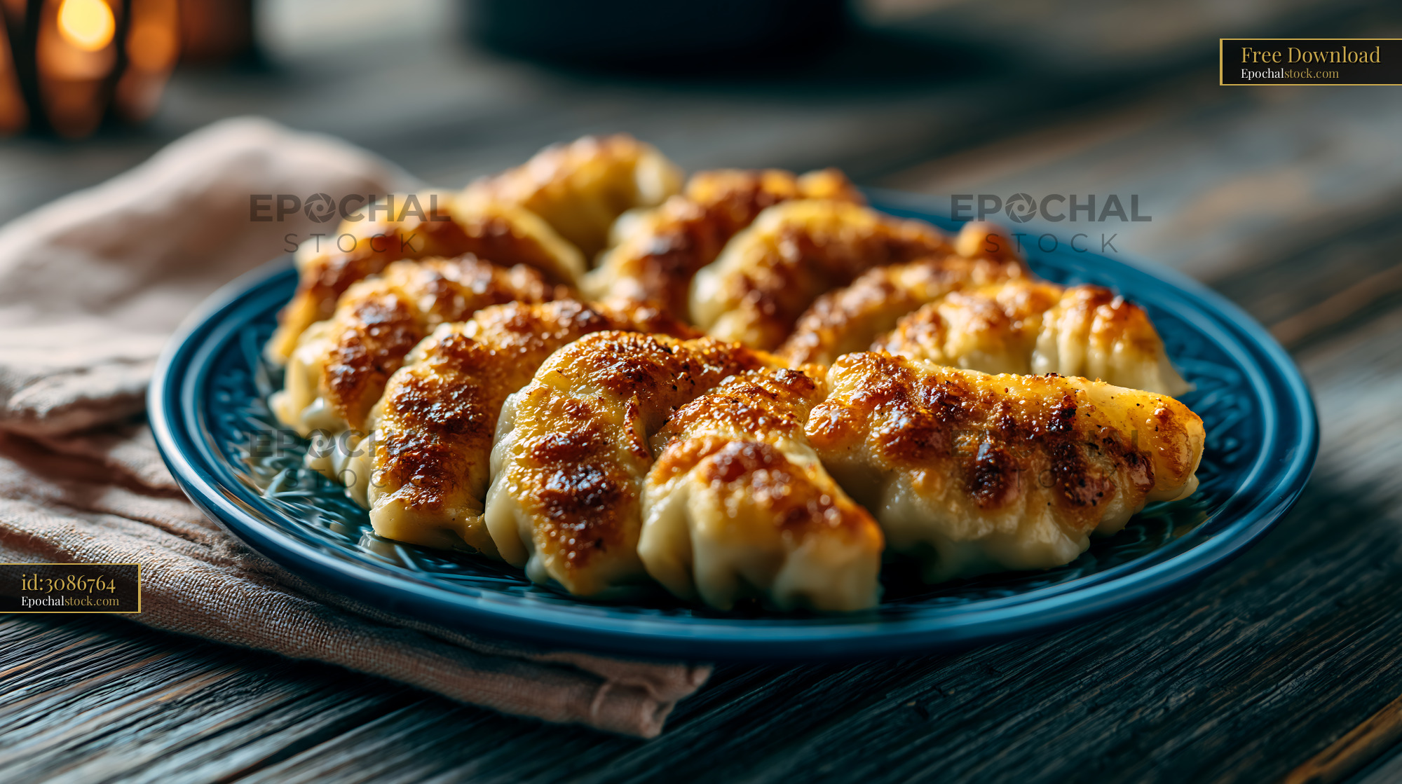 Watermarked full-resolution preview of Delicious dumplings served on a blue plate