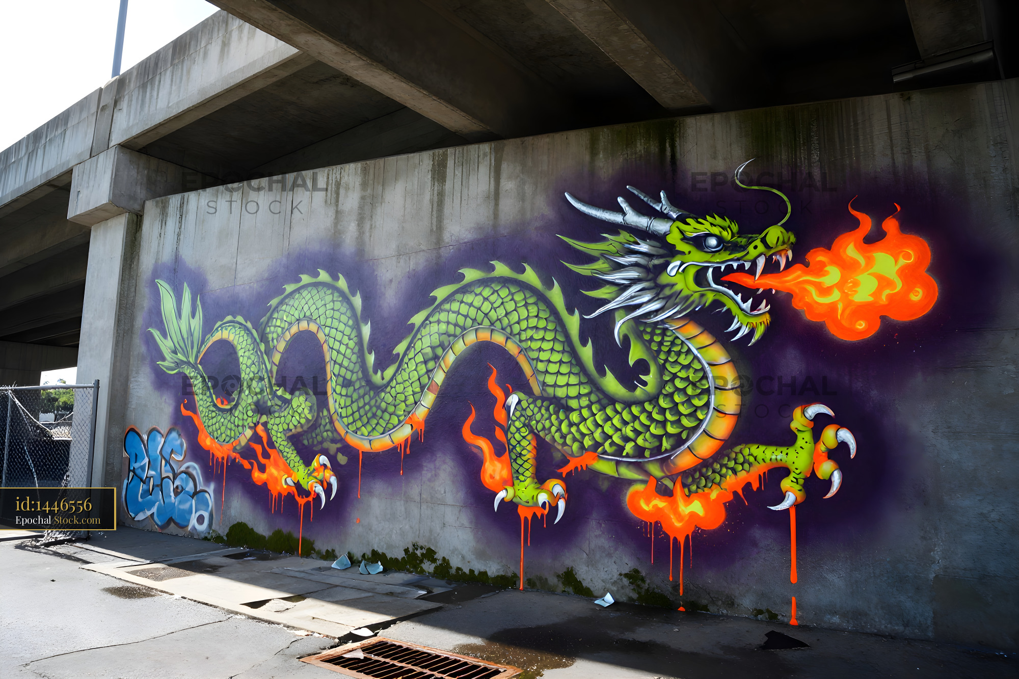 Colorful dragon mural under highway near city street Premium Stock Image