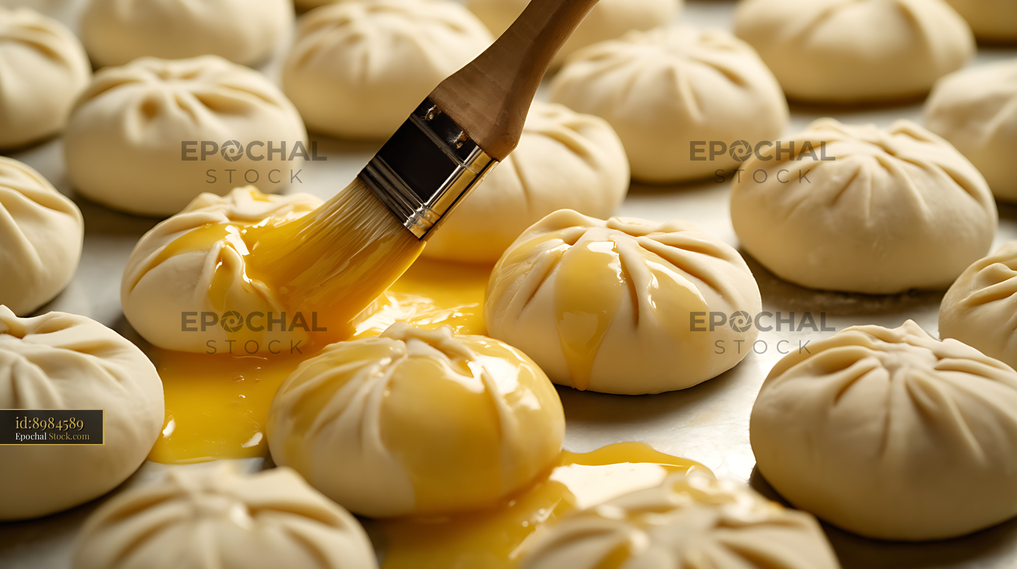 Bierocks with Golden Egg Wash Glaze in Professional Bakery - stock photo