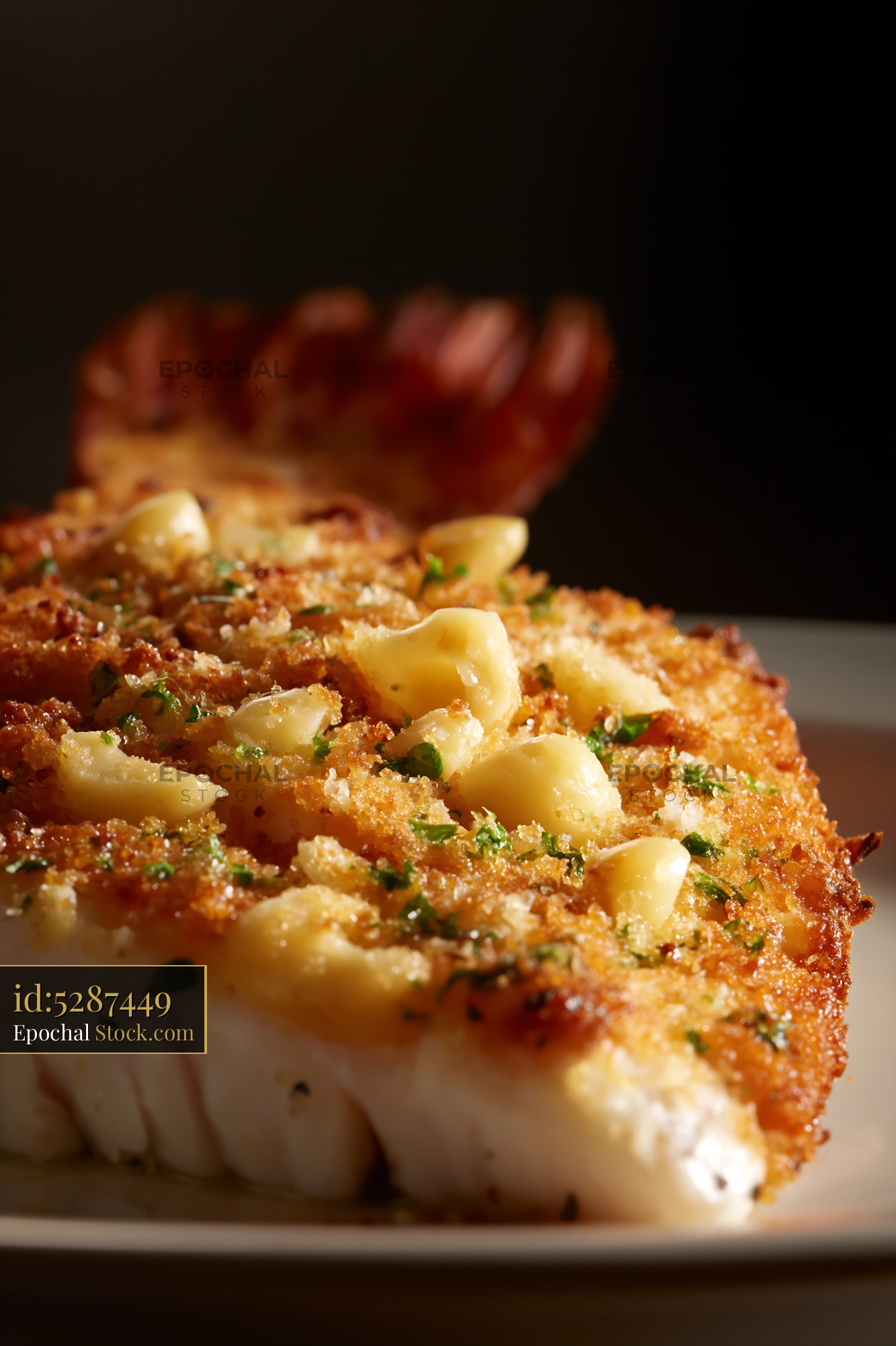 Seared Scallop with Crispy Garlic and Fresh Herbs - stock photo