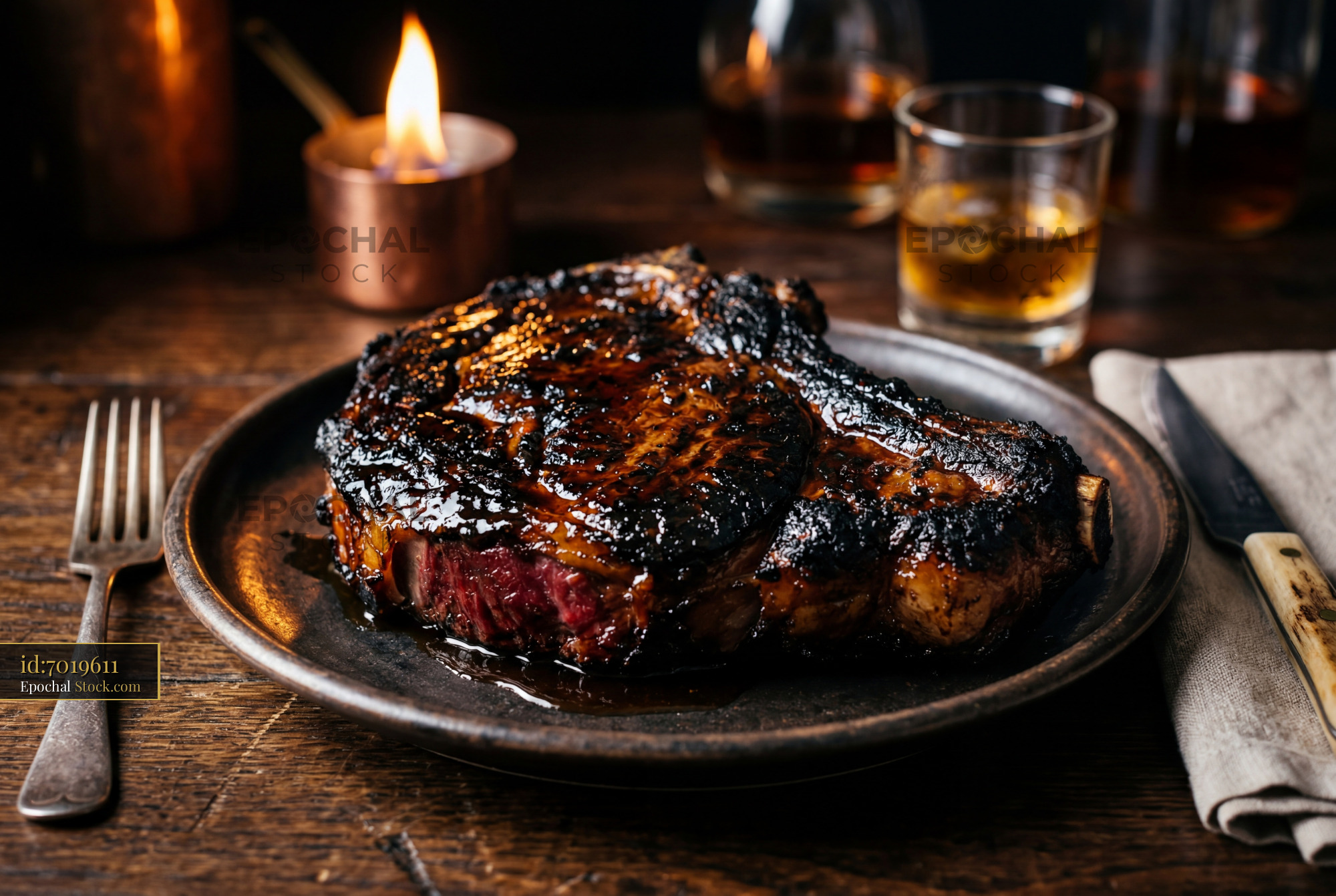 Seared Steak Dinner with Whiskey and Candles - stock photo