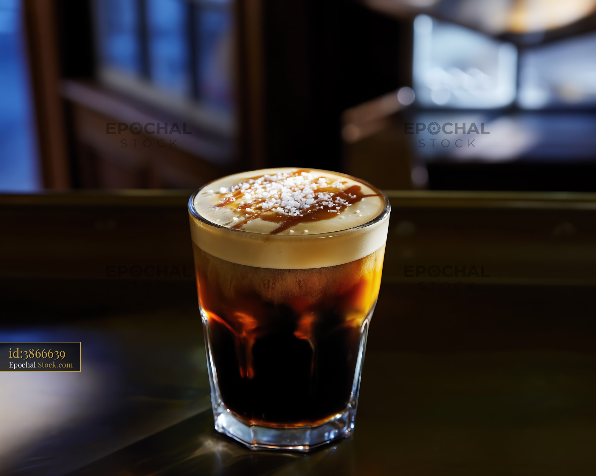 Salted Caramel Iced Coffee on Dark Bar Counter - stock photo