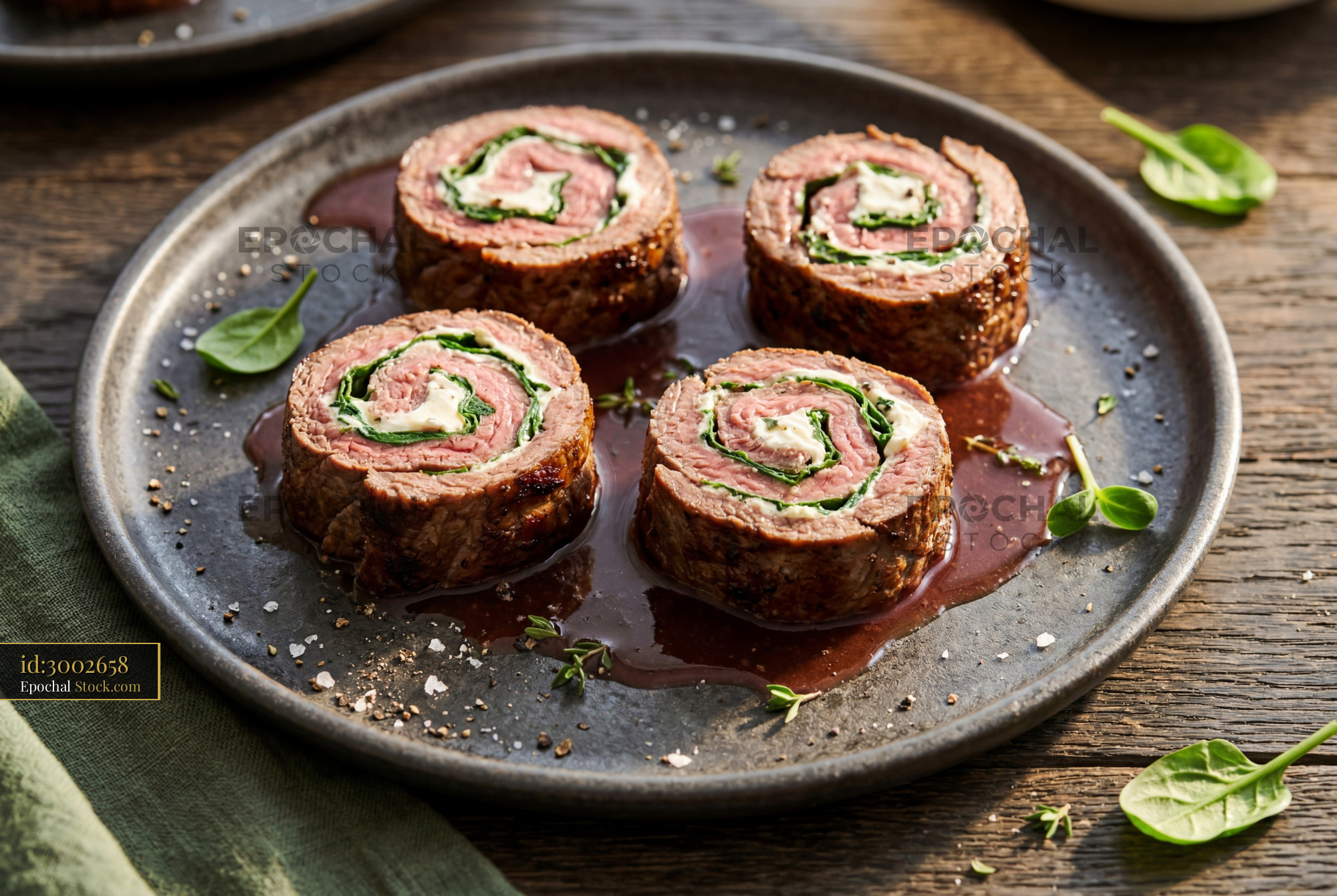 Beef Roulade Sliced with Spinach and Sauce - stock photo