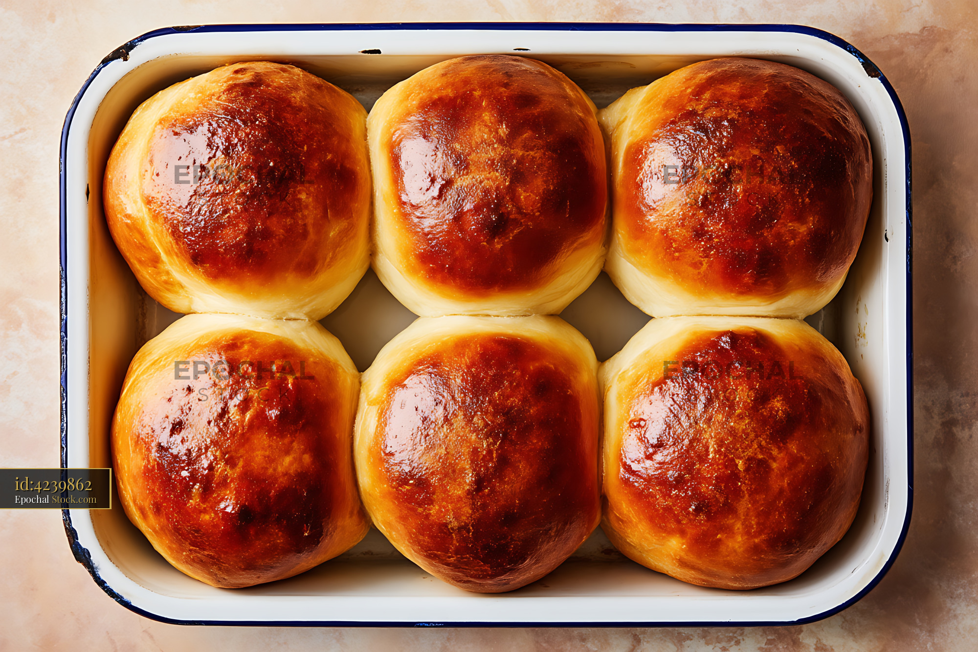 Freshly Baked Golden Dinner Rolls in Enamel Pan - stock photo