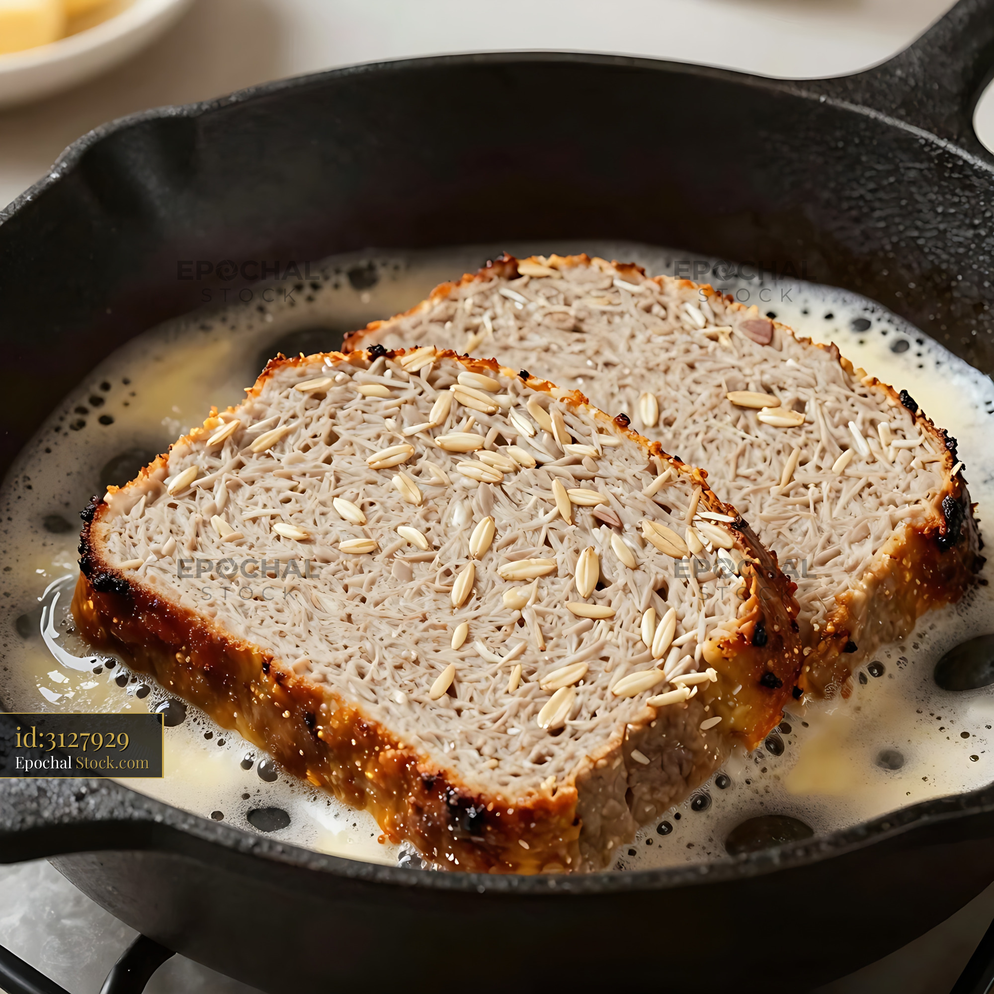 Almond Toast Cooking in Cast Iron Skillet - stock photo