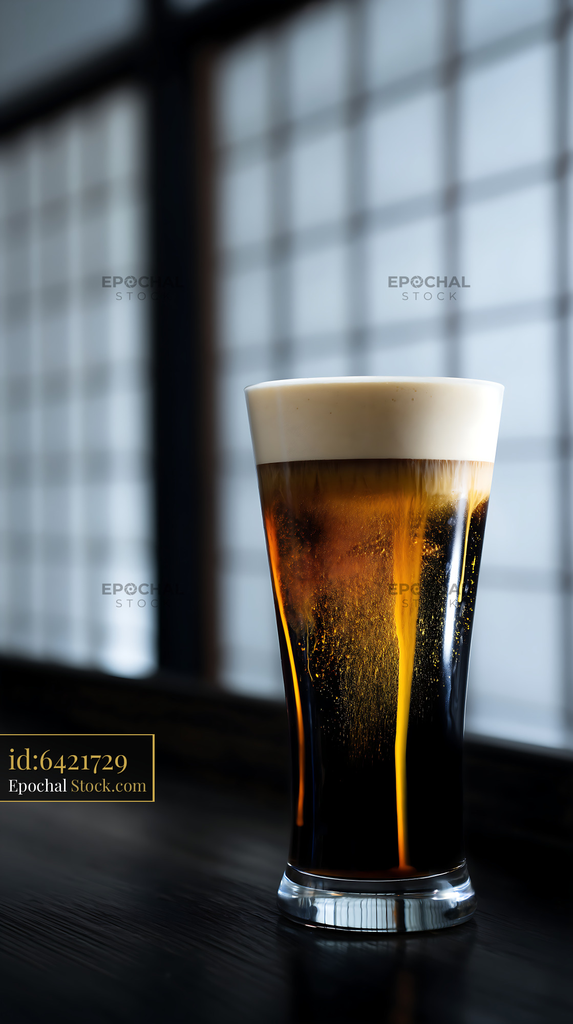 Nitro Caramel Coffee with Cream Head in Window Light - stock photo