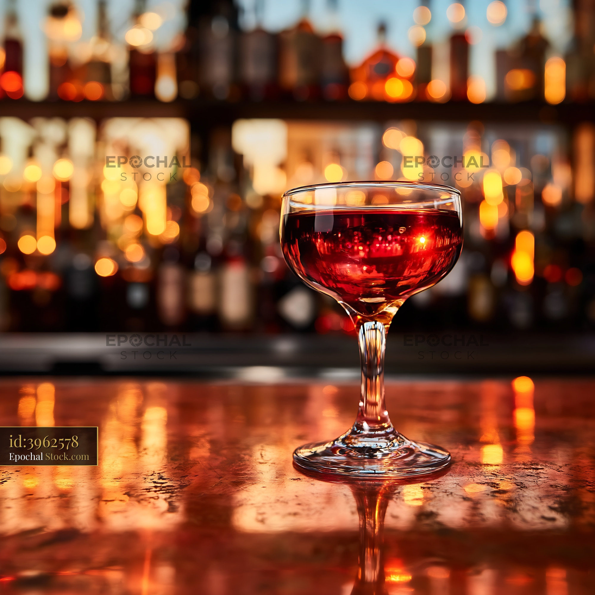 Red Cocktail Glass on Bar Counter Evening Lights - stock photo