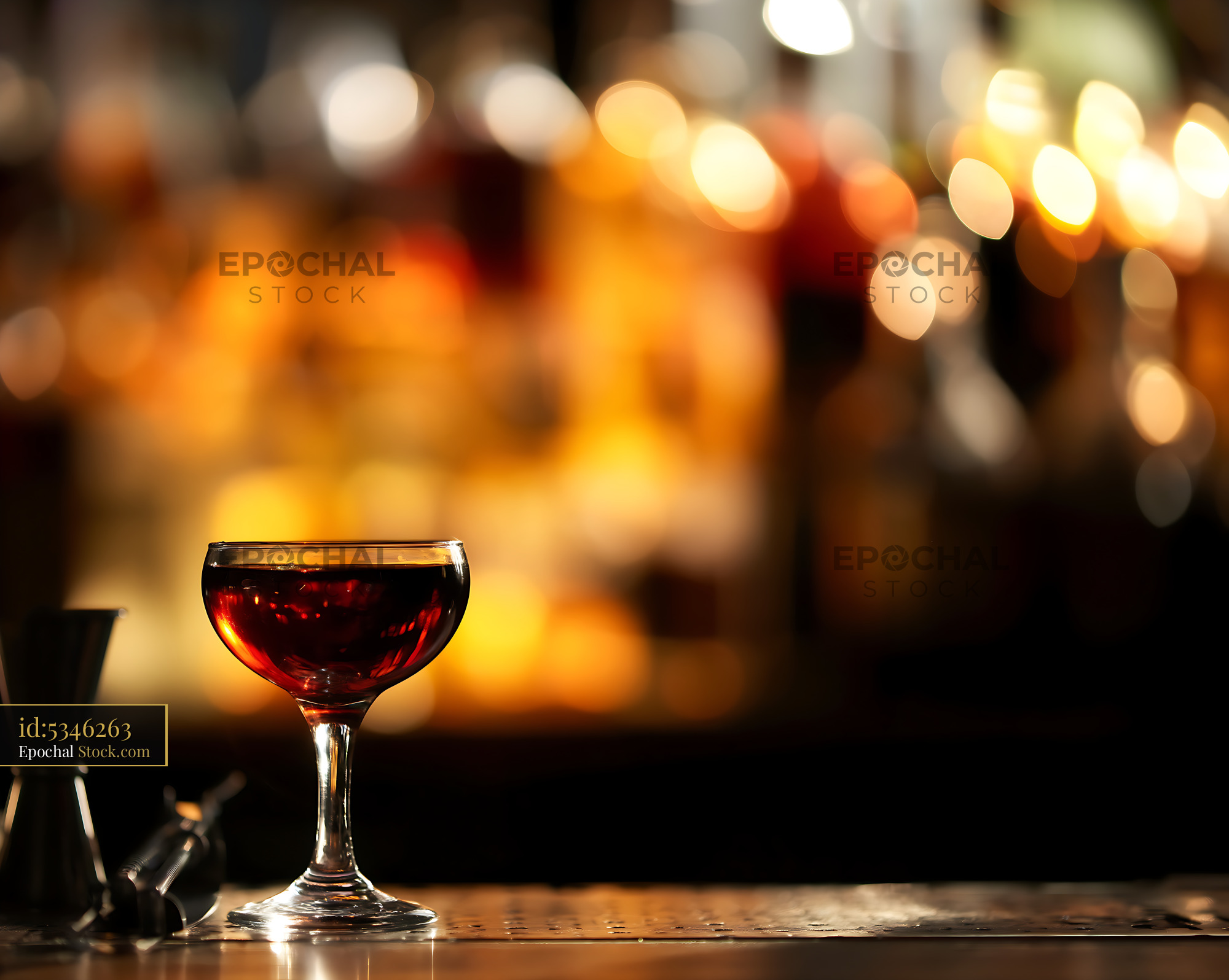 Bushwick Cocktail in Coupe Glass at Bar - stock photo