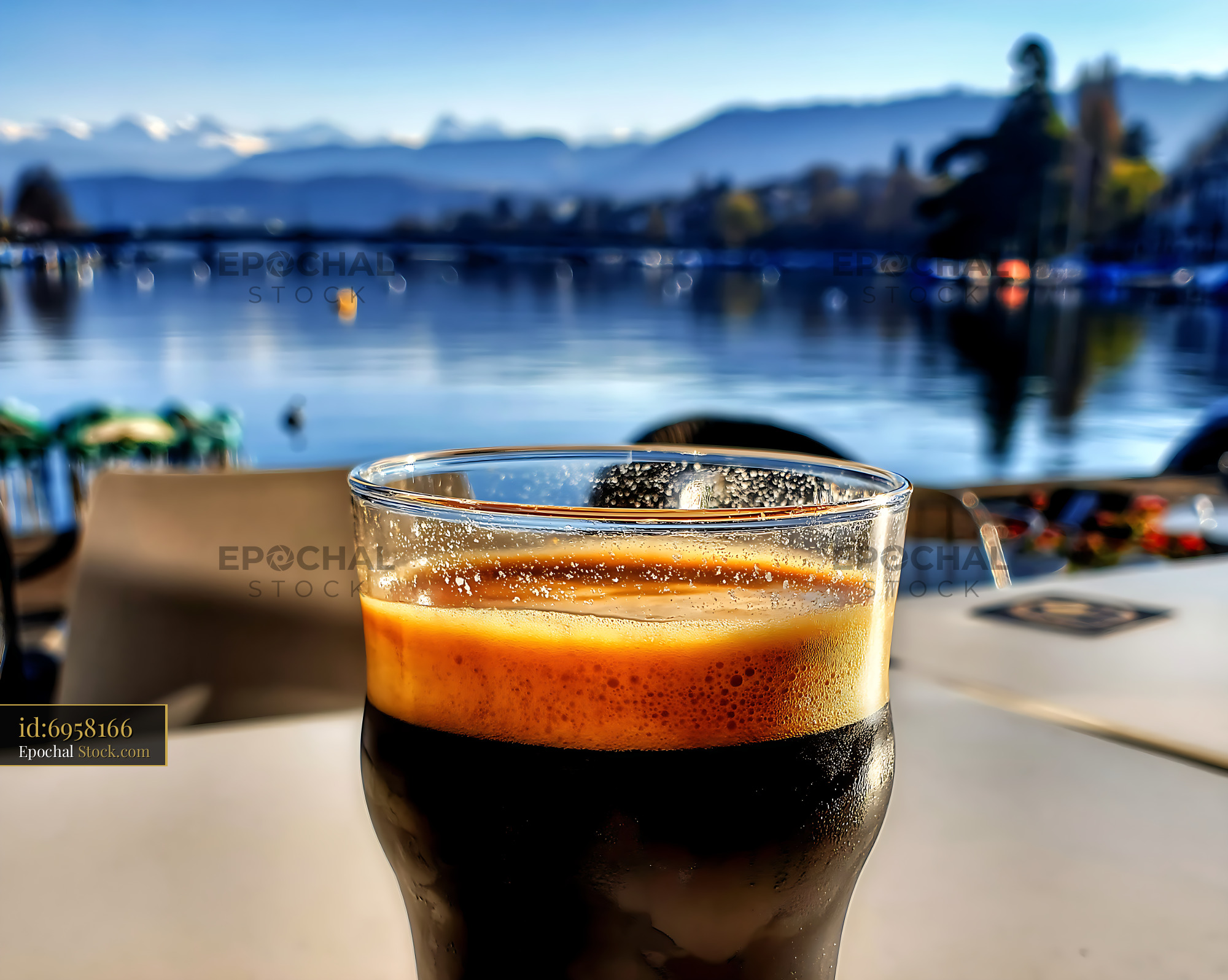Nitro Caramel Coffee with Scenic Lake View - stock photo