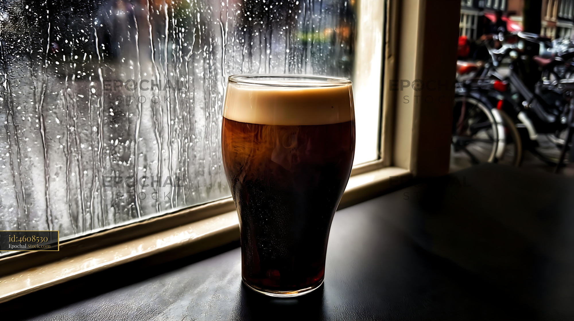 Nitro Caramel Coffee in Glass Window Rainy Day - stock photo
