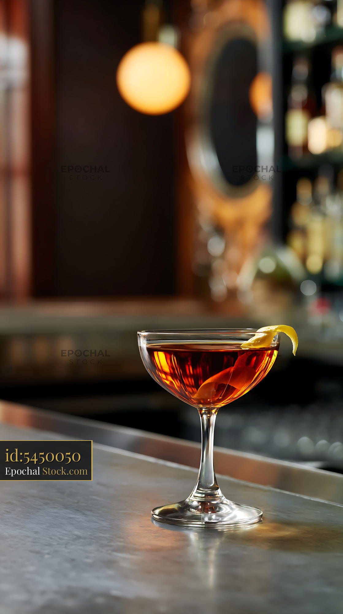 Saratoga Cocktail with Lemon Twist at Bar Counter - stock photo