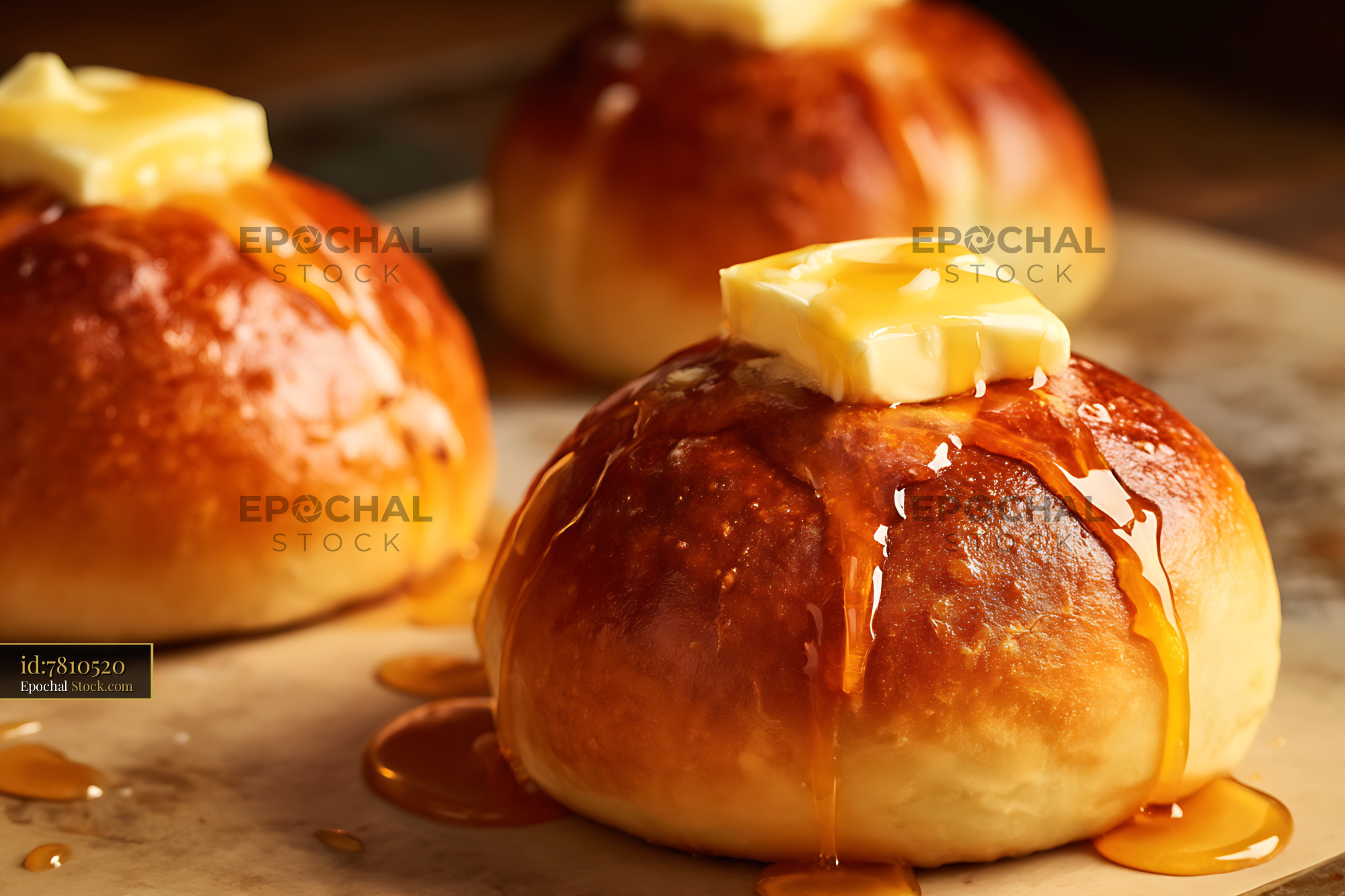 Golden Brioche Rolls with Melting Butter - stock photo