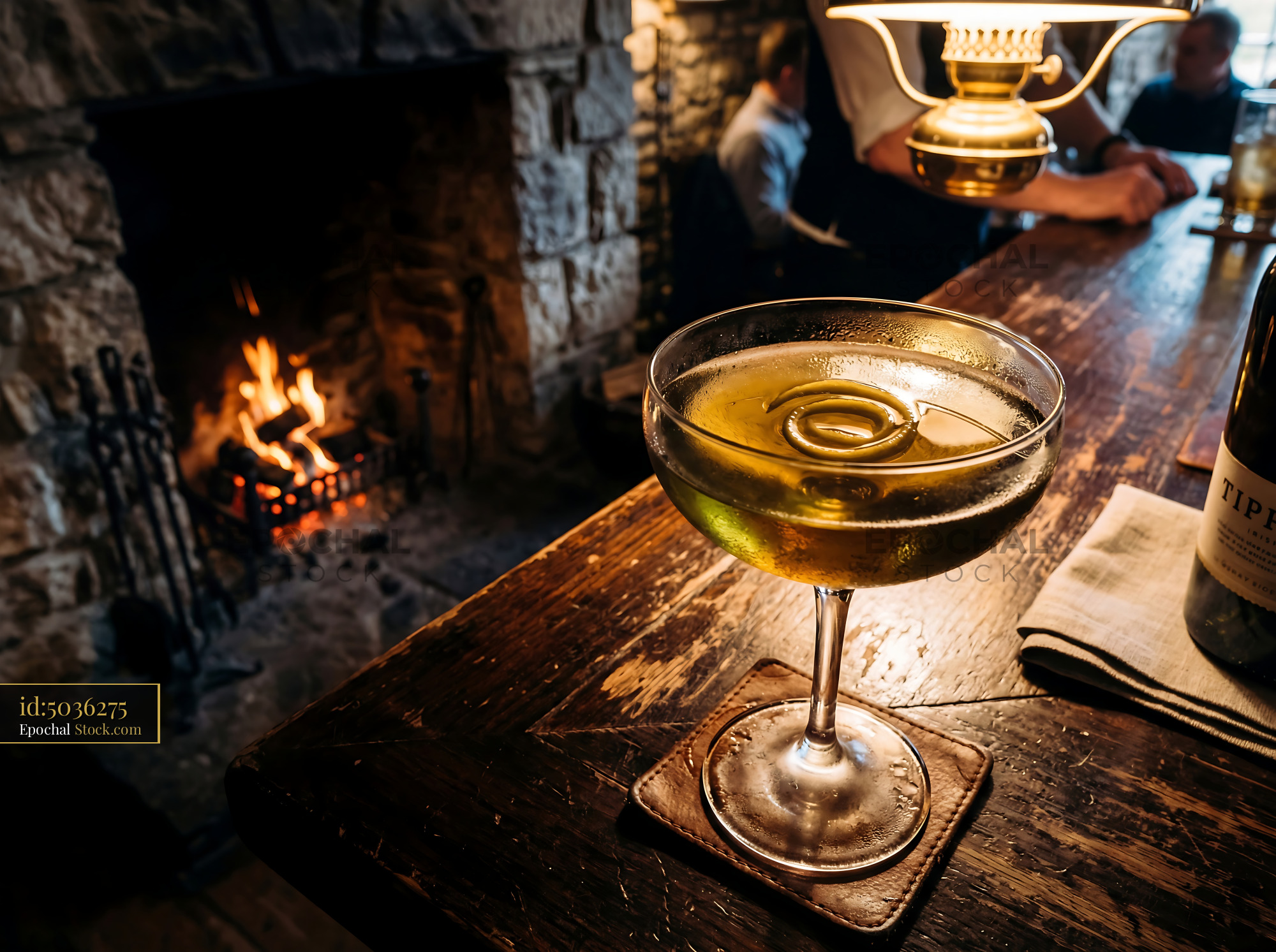Tipperary Cocktail by Warm Fireplace - stock photo