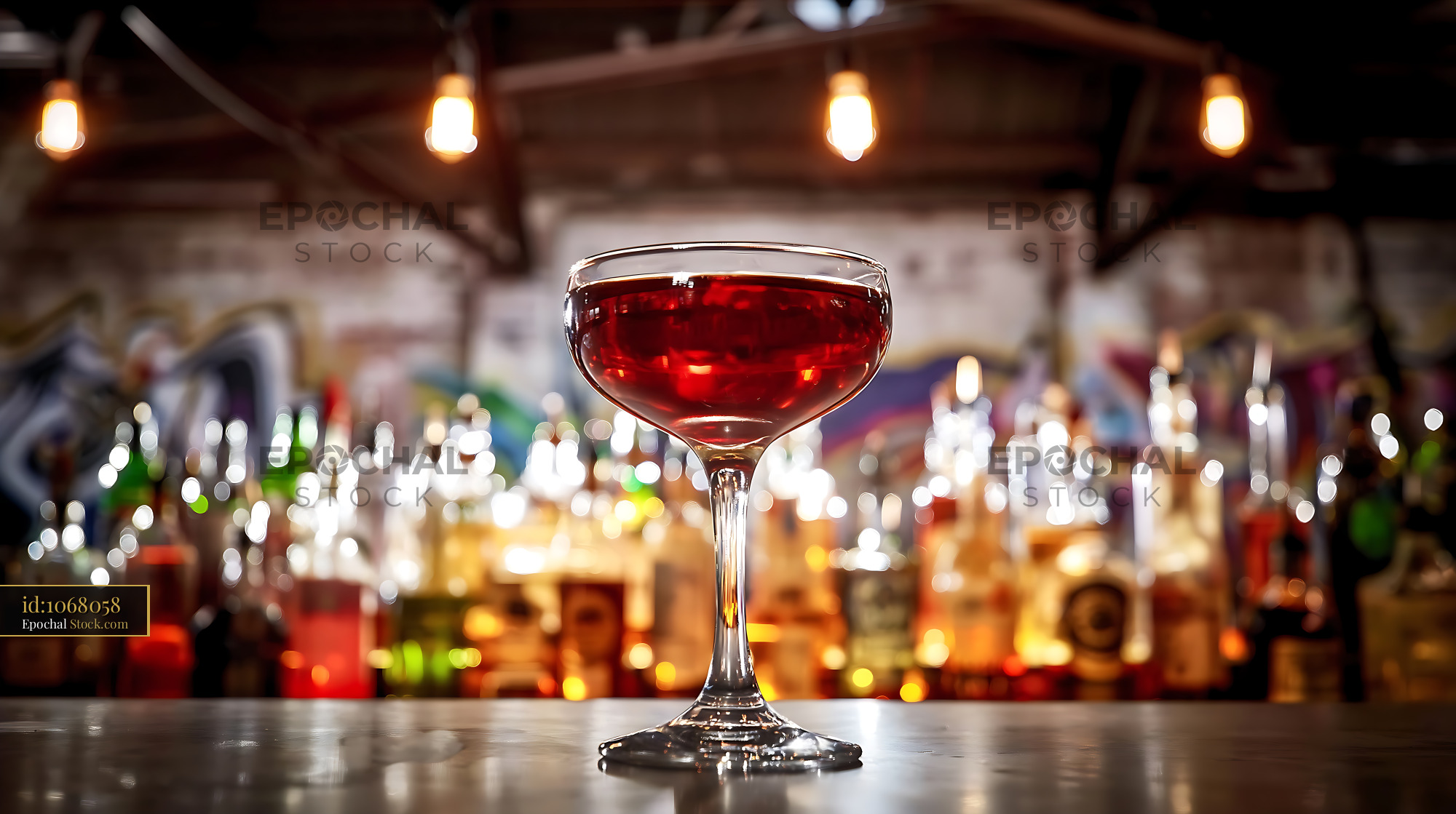 Bushwick Cocktail in Coupe Glass at Bar - stock photo