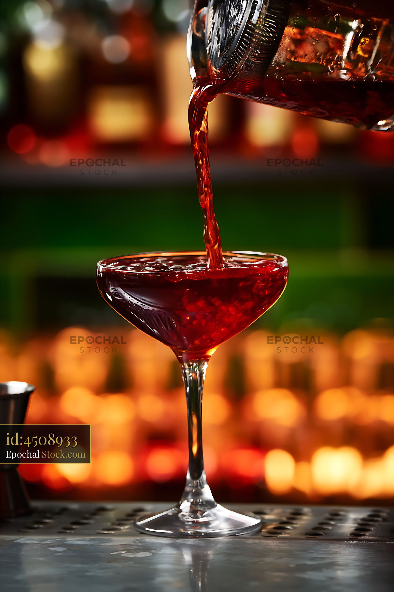 Bushwick Cocktail Being Poured Into Coupe Glass - stock photo