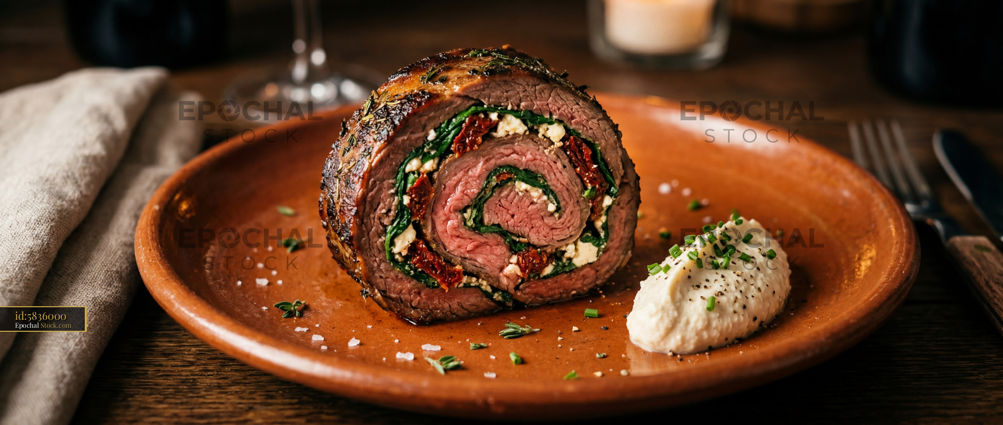 Herb-Crusted Beef Roulade with Goat Cheese - stock photo