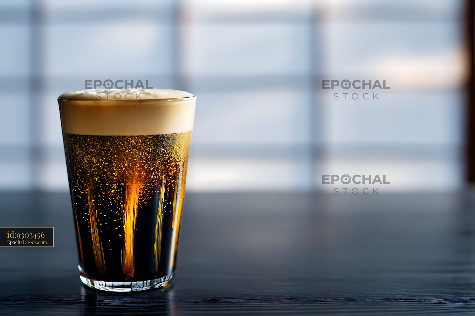 Nitro Caramel Coffee Glass with Creamy Head - stock photo