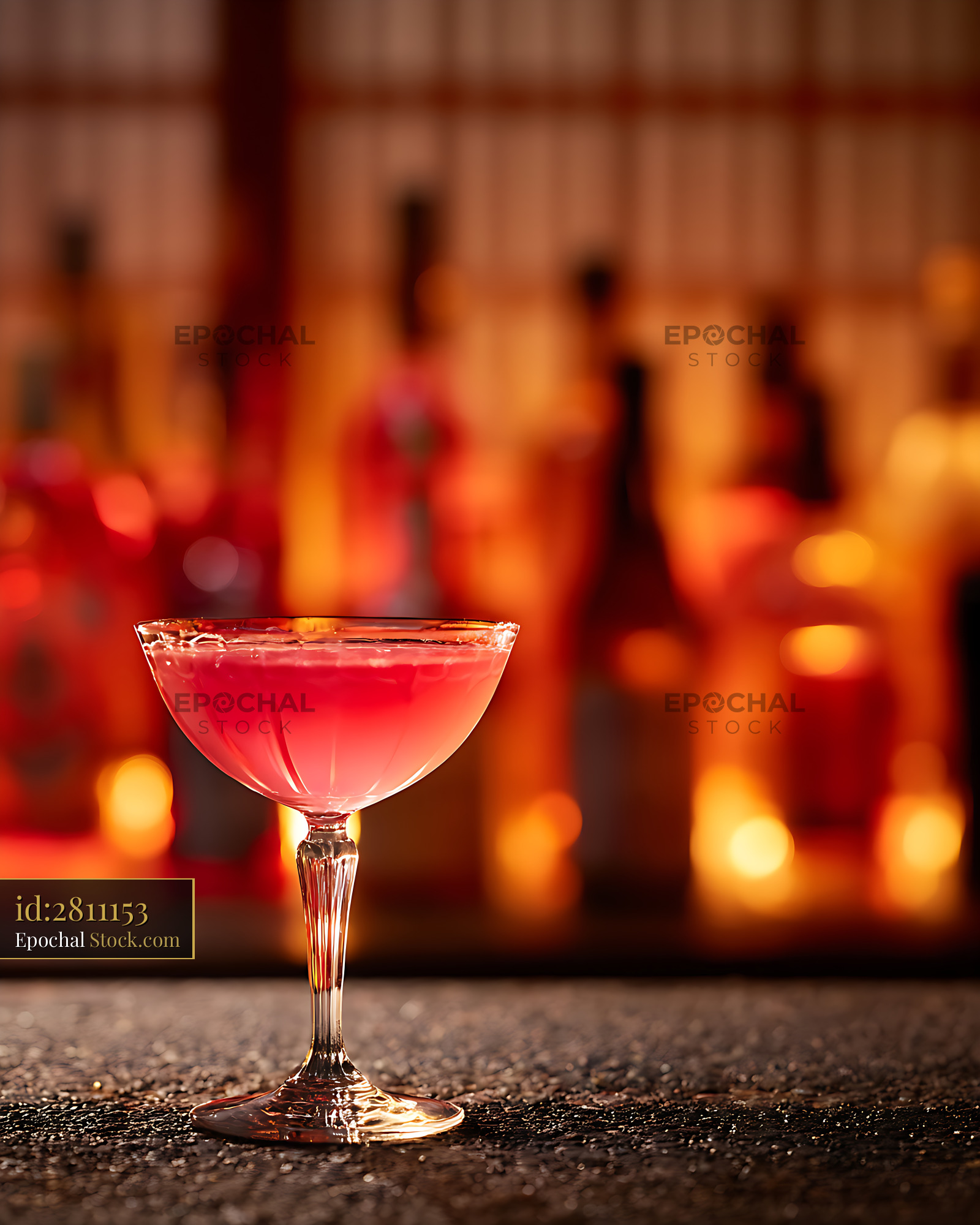 Red Cocktail Glass at Bar with Warm Bokeh Lights - stock photo