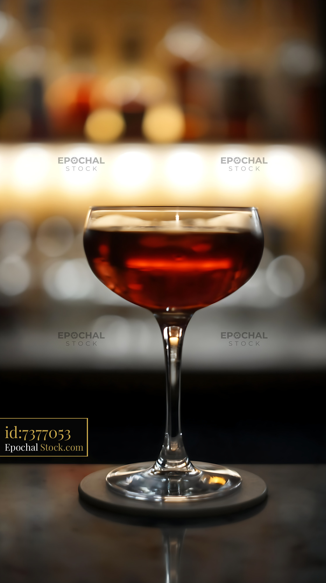 Bushwick Cocktail in Coupe Glass at Bar - stock photo