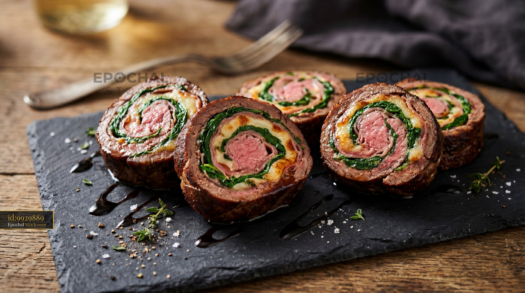Beef Wellington Slices on Black Slate Plate - stock photo